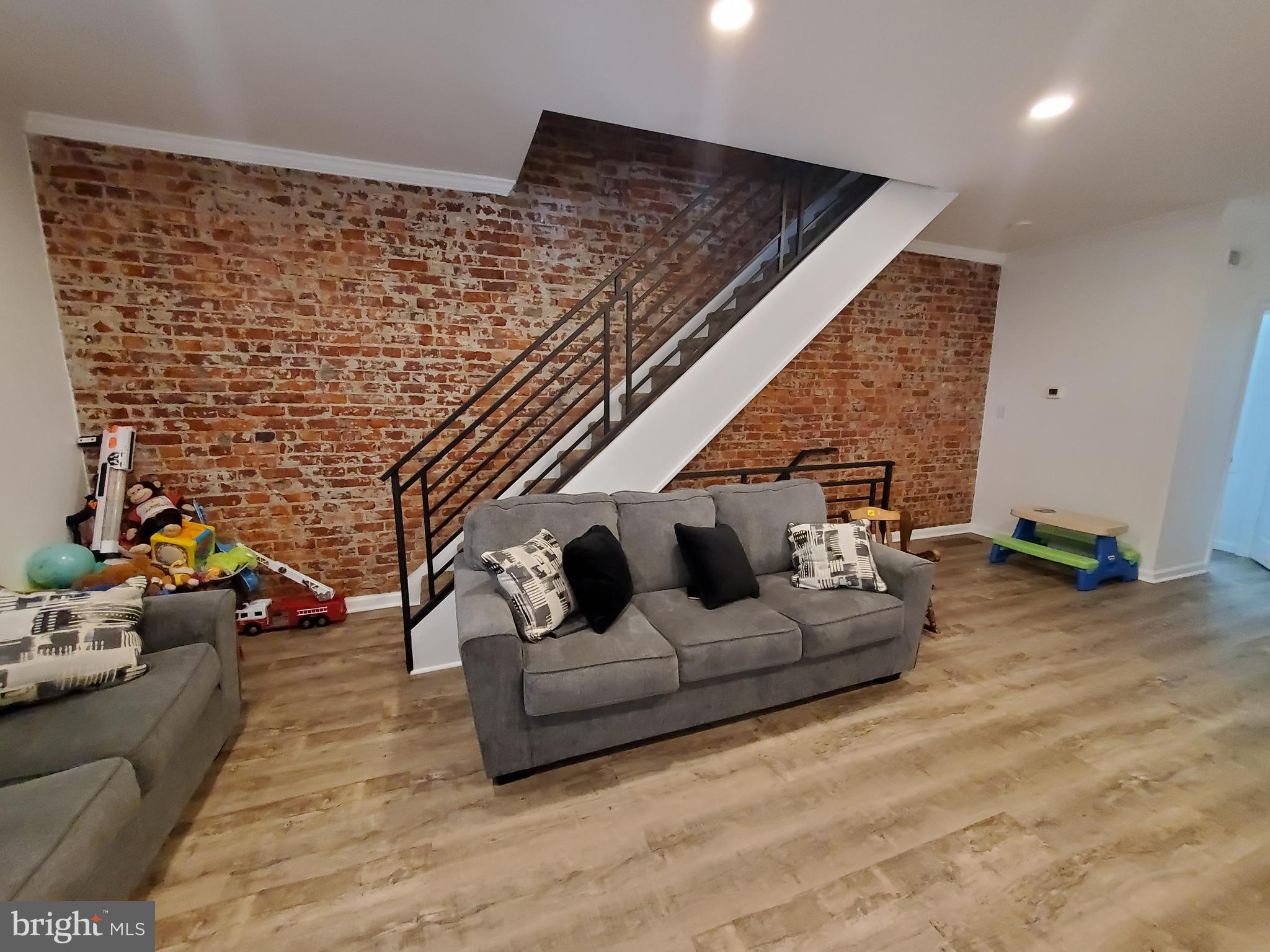 This is one of the most thorough rehabs you'll find!  New roof, new heating and air conditioning systems, new sewer line out to the curb, new concrete in the front and the rear of the property, new 200 amp electrical service, all set a solid foundation.  Plus, everything has been made modern and inviting with an exposed brick wall, all new flooring throughout, brand new kitchen with stainless steel appliances and granite countertops, new bathrooms with a half bath on the 1st floor.  Finished off with recessed lighting and modern fixtures throughout! This home also offers the front porch and spacious rear yard.   For the investor looking for a turn key rental: tenant is currently paying $1200 a month and would like to stay.
