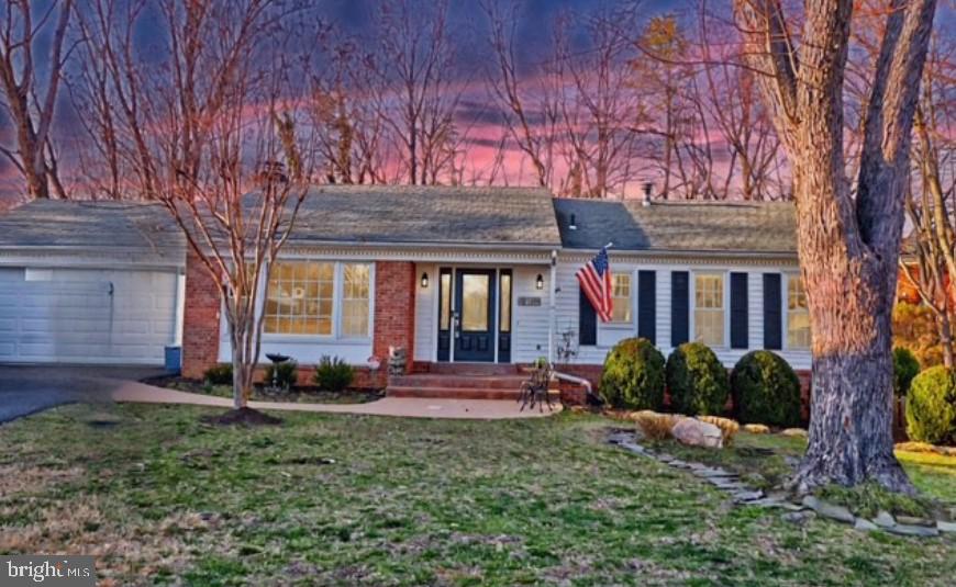 Welcome to this charming and spacious ranch/rambler home nestled in a peaceful cul-de-sac in the heart of Springfield! This well-maintained residence offers 5 bedrooms, 3.5 bathrooms, and a finished basement, providing ample space for comfortable living and entertaining. As you enter, you'll be greeted by an inviting foyer with elegant hardwood floors that flow seamlessly throughout the main level. The layout features a formal living room and dining room, perfect for hosting gatherings. The updated kitchen boasts corian countertops, stainless steel appliances with cabinet space for all your culinary needs. The adjacent family room (sun room) is ideal for relaxing after a long day. It provides wonderful natural light and can be used at all times of the year.  Downstairs, the primary bedroom offers a private retreat with spacious closet space and a luxurious en-suite bathroom featuring a separate shower, and dual vanities.  The family room downstairs is complete with a wood-burning fireplace and large mantle, perfect for enjoying a cozy winter night.  Another full-size bedroom, a bonus room that can be used as an office, laundry room and ample storage space round out the lower level.  The upstairs level includes a second master bedroom (with a full bath), two additional bedrooms and another full bathroom, providing plenty of space for family or guests. Outside, the beautifully landscaped yard provides the perfect space for outdoor enjoyment. The large deck is perfect for dining or simply relaxing while overlooking the fenced backyard. Located just minutes from shopping, dining, and major commuter routes, including Saratoga Park & Ride and the Springfield-Franconia Metro, this home combines convenience and tranquility. Don’t miss the opportunity to make this wonderful property your own!