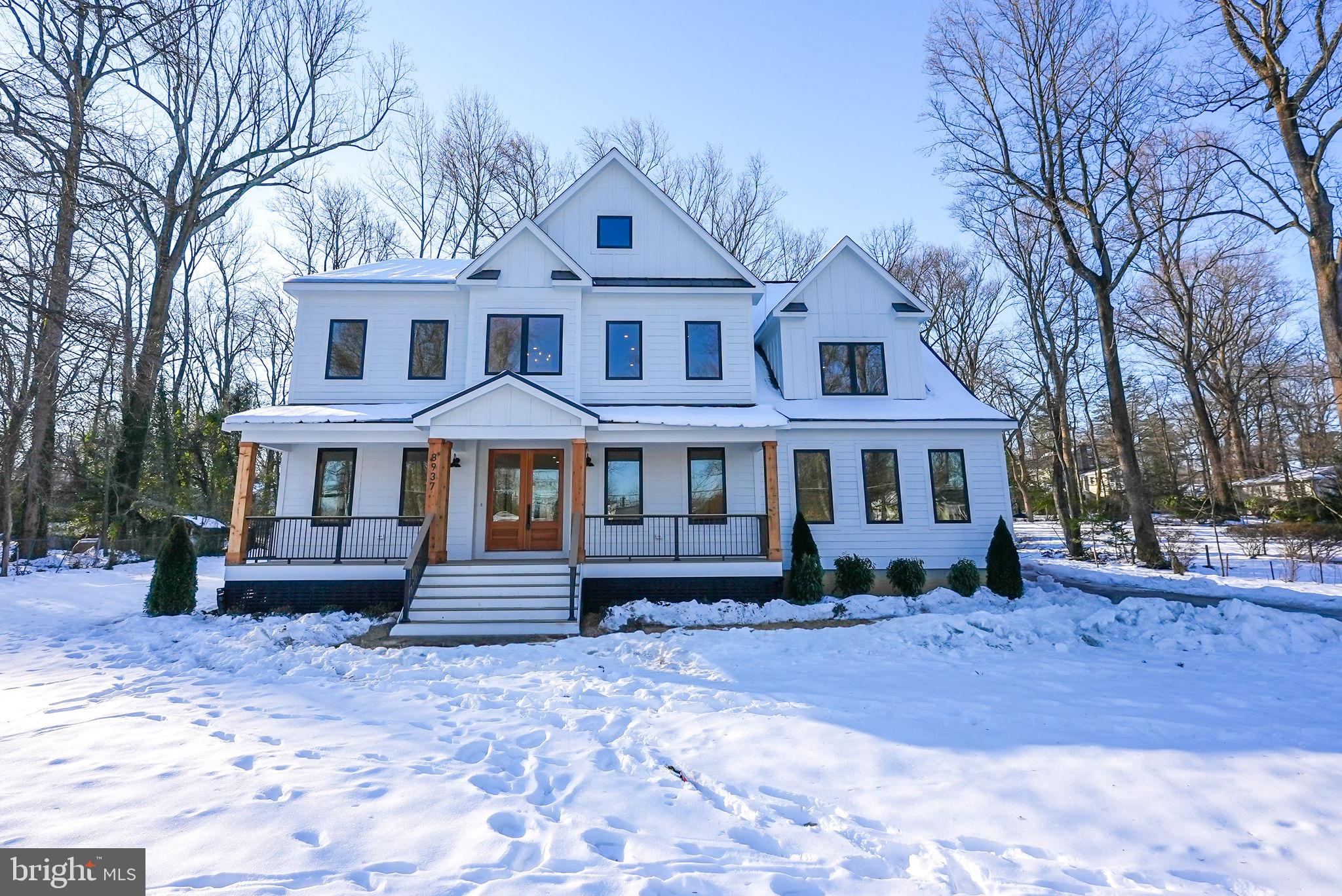 Discover this exquisite new construction home, boasting over 7,400 square feet of luxury on a flat .76 acre lot in the prestigious Woodson HS Pyramid. This residence features a side-load 3-car garage and an array of elegant amenities, including a main-level en-suite bedroom/office, four en-suite bedrooms upstairs, and another en-suite on the lower level.
The main floor impresses with formal living and dining rooms, a chef's gourmet kitchen equipped with high-end Monogram appliances, custom cabinetry, a large island with a prep sink, and a walk-in pantry with a beverage center and coffee bar. Premium quartz countertops add a touch of sophistication throughout. Enter through the Fir double front doors from the welcoming covered TimberTech front porch, and be greeted by a stunning 2-story foyer. Revel in the beauty of the 7.5” European white oak hardwood floors and 10-foot ceilings.
The family room is highlighted by a 72” linear gas fireplace and built-in speakers, while the 12-foot sliding glass doors lead to a 30-foot maintenance-free TimberTech deck, perfect for entertaining. A spacious mudroom, morning room, study/bedroom en-suite, and half bath enhance the main level's functionality.
The finished lower level is bathed in natural light, offering a bedroom, full bath, exercise room, recreation room, media room, wet bar, and ample storage space, blending elegance and practicality.
Upstairs, the luxurious primary suite includes a sitting area, expansive bathroom with a soaking tub, dual vanities, a skylight over the spacious shower, and a walk-in closet. Three additional en-suite bedrooms with walk-in closets and a laundry room with built-in designer cabinetry and a utility sink with quartz countertops complete the level. All bathrooms feature Delta Shower systems, designer tiles, and vanities.
This remarkable home is equipped with dual-zone Carrier HVAC systems, a 1000-gallon underground propane tank with auto-refill, a 75-gallon gas water heater, PVC exterior trim, 30-year shingles, and Hardie board siding, ensuring style and durability. Oversized aluminum gutters, downspouts, a storm drain system, and Andersen casement windows enhance the home's appeal.
Conveniently located on a quiet street with easy access to major commuting routes, shopping centers, INOVA Fairfax Hospital, and the Vienna metro station, this home is a commuter's dream. It seamlessly blends state-of-the-art features with meticulous craftsmanship for an unparalleled living experience.