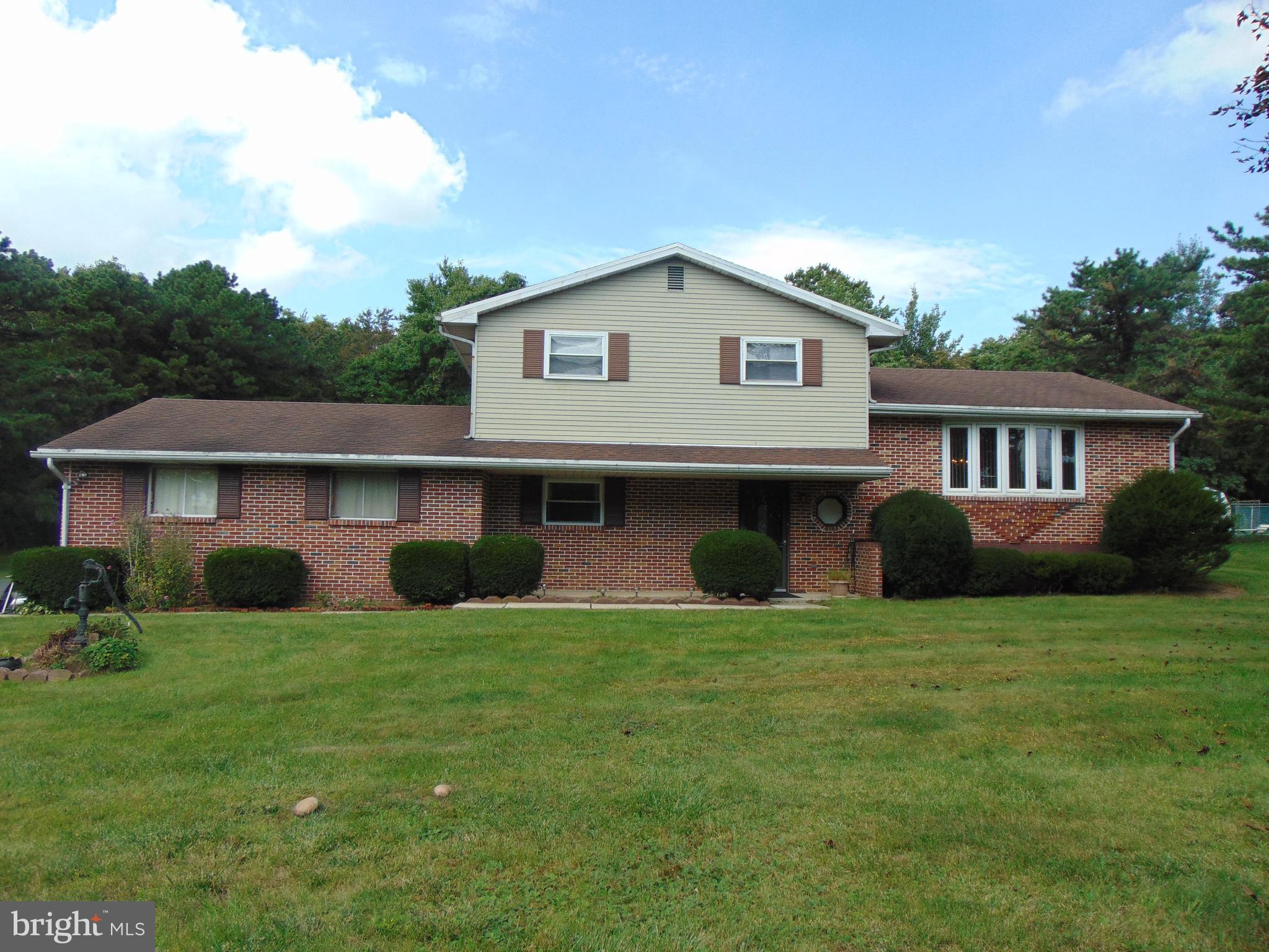 Exceptional split level home situated on 1/2 acre flat lot.  This split level home features lower level family room with corner brick fireplace, bedroom/den and half bath.  Main level offer a sundrenched living room and dining room and fully appliance kitchen.  Upper level offer large Master Suite with private access to full bath.  2 additional bedrooms with ample closet space complete the upper level.  Oversized 2 car garage.  Outside boasts privacy at its best.  Concrete patio overlooking lush tree lined yard.  Owners have maintained with excellence inside and out