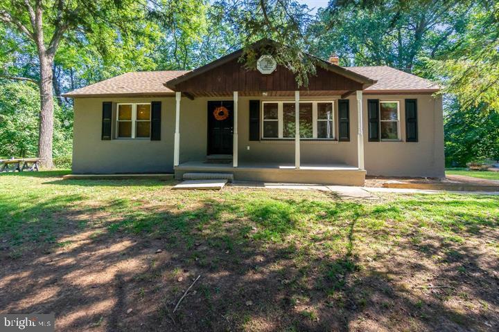 Welcome to 211 E. Wheel Road, a rare opportunity to own a charming ranch-style home set on over 1.5 acres in the highly sought-after Patterson Mill School District. Tucked away on a beautiful, wooded lot, this property offers privacy, space, and exceptional potential—all just minutes from the conveniences of Bel Air.  This inviting home features three bedrooms and two full bathrooms, with a layout that highlights both comfort and character. Inside, you’ll find warm hardwood flooring, a vaulted ceiling in the kitchen that enhances the sense of openness, and elegant French doors that add charm and natural light throughout the living spaces.  The walk-out lower level expands the home’s versatility, offering two partially finished rooms and an additional full bathroom—ideal for a recreation area, home office, guest space, or future customization to suit your needs.  Surrounded by mature trees and natural beauty, the expansive lot provides endless possibilities for outdoor living, gardening, or simply enjoying a peaceful setting. With potential subdivision opportunities (buyer to verify with the county), this property also presents a unique investment angle for those looking to maximize value.  A true hidden gem, 211 E. Wheel Road combines character, land, and opportunity in one of Harford County’s most desirable locations.