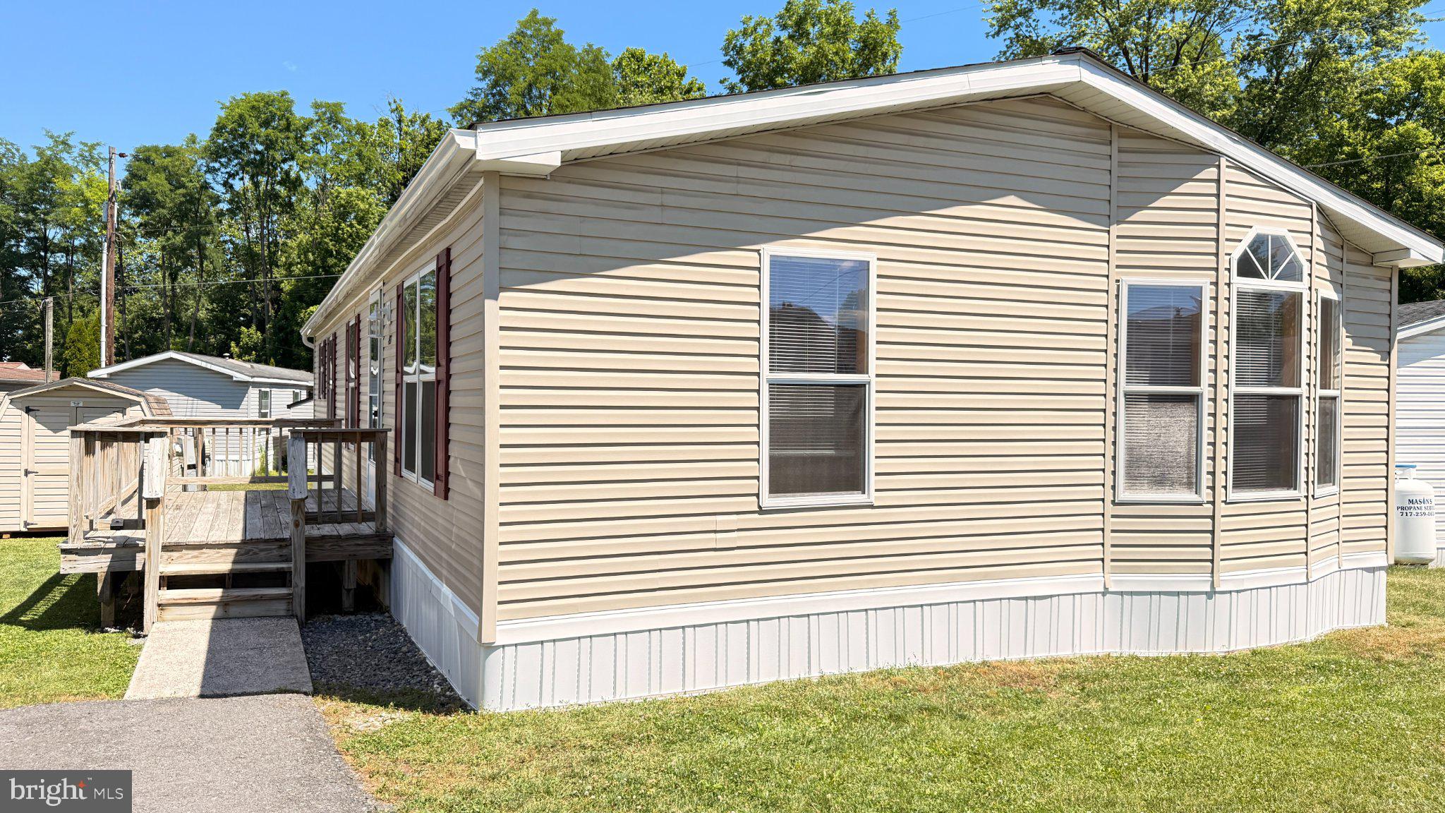 Beautifully updated mobile in 55+ community --- newer HVAC, flooring & kitchen!  Neat and tidy --- this home shows like new! Park approval in 55+ community will be REQUIRED.