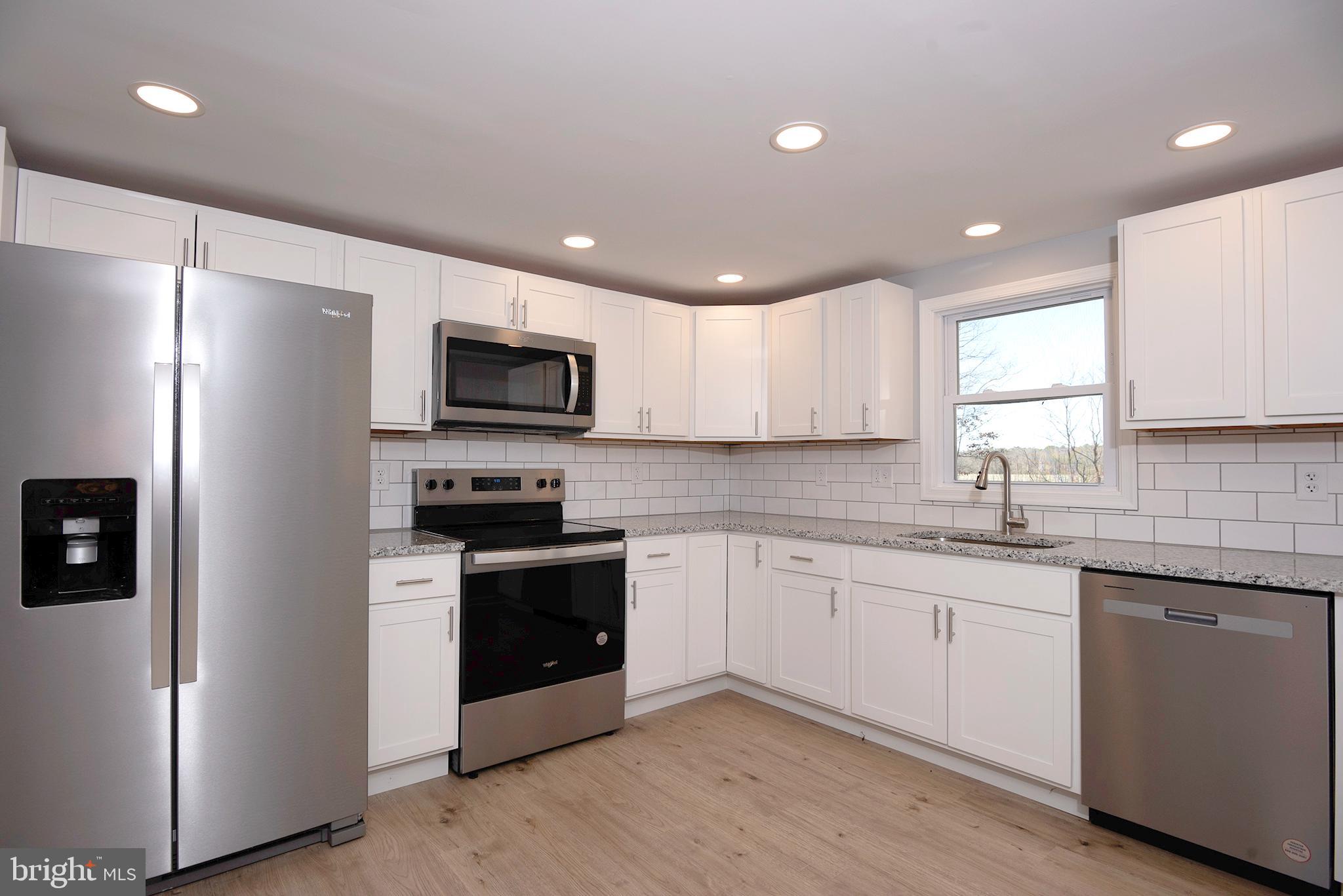 Welcome to life in Rock Hall — a charming waterfront town where the pace is slower, the people are friendlier, and the Chesapeake Bay lifestyle is part of everyday living. 
*SELLER ASSISTANCE AVAILABLE TOWARDS CLOSING COSTS*

This lovingly renovated home was thoughtfully updated by owners who cared about the details—not a quick flip—resulting in a property full of character and quality improvements throughout. Inside, you’ll find beautiful LVP flooring, a bright open-concept layout, and a stunning kitchen featuring granite countertops, a tile backsplash, stainless steel appliances, and plenty of space to gather after a day on the water, experiencing Chestertown and all the other towns nearby! Owner had a pre home inspection for your convenance! The home is good to go!

For peace of mind, all major systems are new, including a brand-new roof, and a home inspection has already been completed with items addressed, making this home truly move-in ready.

The layout offers comfort and privacy with the primary suite tucked away on one side of the home, while the three additional bedrooms are located on the opposite side, perfect for maybe or a home office setup. The home is connected to public water and sewer, and also offers fiber internet, giving you modern convenience in a laid-back coastal setting.

Step outside and enjoy the freedom that comes with no restrictions—bring your boat, RV, or water toys, and if you’ve been dreaming of building a pole barn or workshop, you can do that here too.

Located just minutes from creeks, rivers, and the Chesapeake Bay, this home places you right in the heart of one of the Eastern Shore’s most beloved boating towns. Rock Hall may only have one traffic light, but it’s full of life—with marinas, waterfront restaurants, coffee shops, boutiques, ice cream stops, and a quaint downtown. The town hosts events throughout the year, creating that true small-town vibe where everyone knows your name—or soon will.

If you’ve been searching for a fun, beachy lifestyle with small-town charm, modern updates, and room for your boats and hobbies, this home delivers.

Rock Hall — where nice people live.
*some photos have been enhanced with virtual staging*