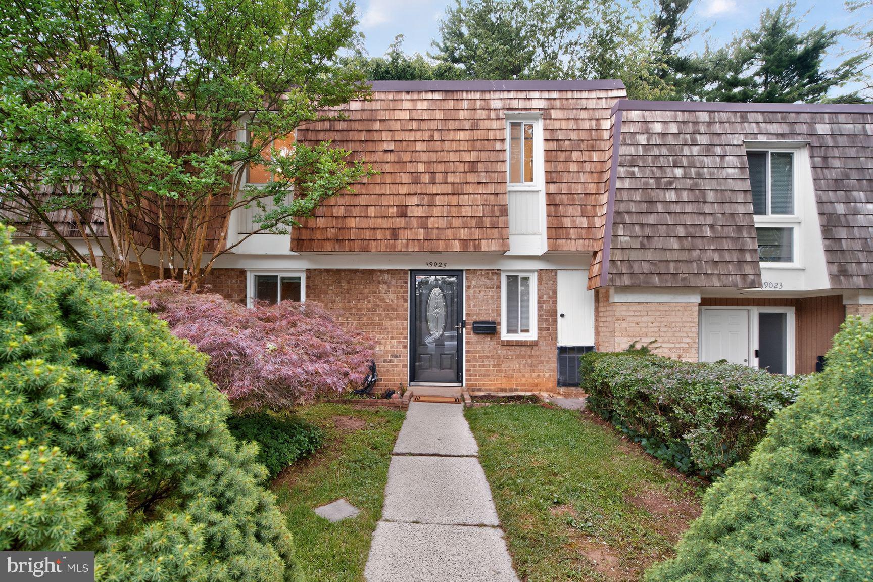 Welcome to this beautifully updated French Provincial-style townhouse in Montgomery Village. This truly move-in-ready home perfectly combines timeless exterior charm with modern interior updates, all while being just minutes from exceptional community amenities, including pools, parks, lakes, walking trails, shopping, and dining. Inside, the thoughtfully designed layout has been freshly painted from top to bottom and features an inviting kitchen equipped with stainless steel appliances, granite countertops, abundant cabinetry for all your storage needs, and a convenient pot filler faucet located right over the stove for effortless cooking. The spacious primary bedroom serves as a relaxing retreat and showcases a striking wood slat accent wall that adds warmth, character, and a custom designer touch. A secondary bedroom features a custom-designed closet system, maximizing organization and functionality. The fully finished lower level provides exceptional versatility and can easily serve as a family room, guest suite, recreation area, or home office. This level also includes a full bathroom and a dedicated laundry room with a newer washer and dryer alongside additional storage space. Step outside to your deeply private backyard retreat, where a spacious, beautifully paved patio creates the perfect setting for grilling, outdoor dining, entertaining guests, or simply relaxing. Because there is no public walking trail directly behind the property, you can enjoy total peace and seclusion. Combining classic curb appeal, thoughtful updates, flexible living spaces, 2 assigned parking spaces, and an unbeatable location, this turn-key home is ready for its next owner to move right in and enjoy.