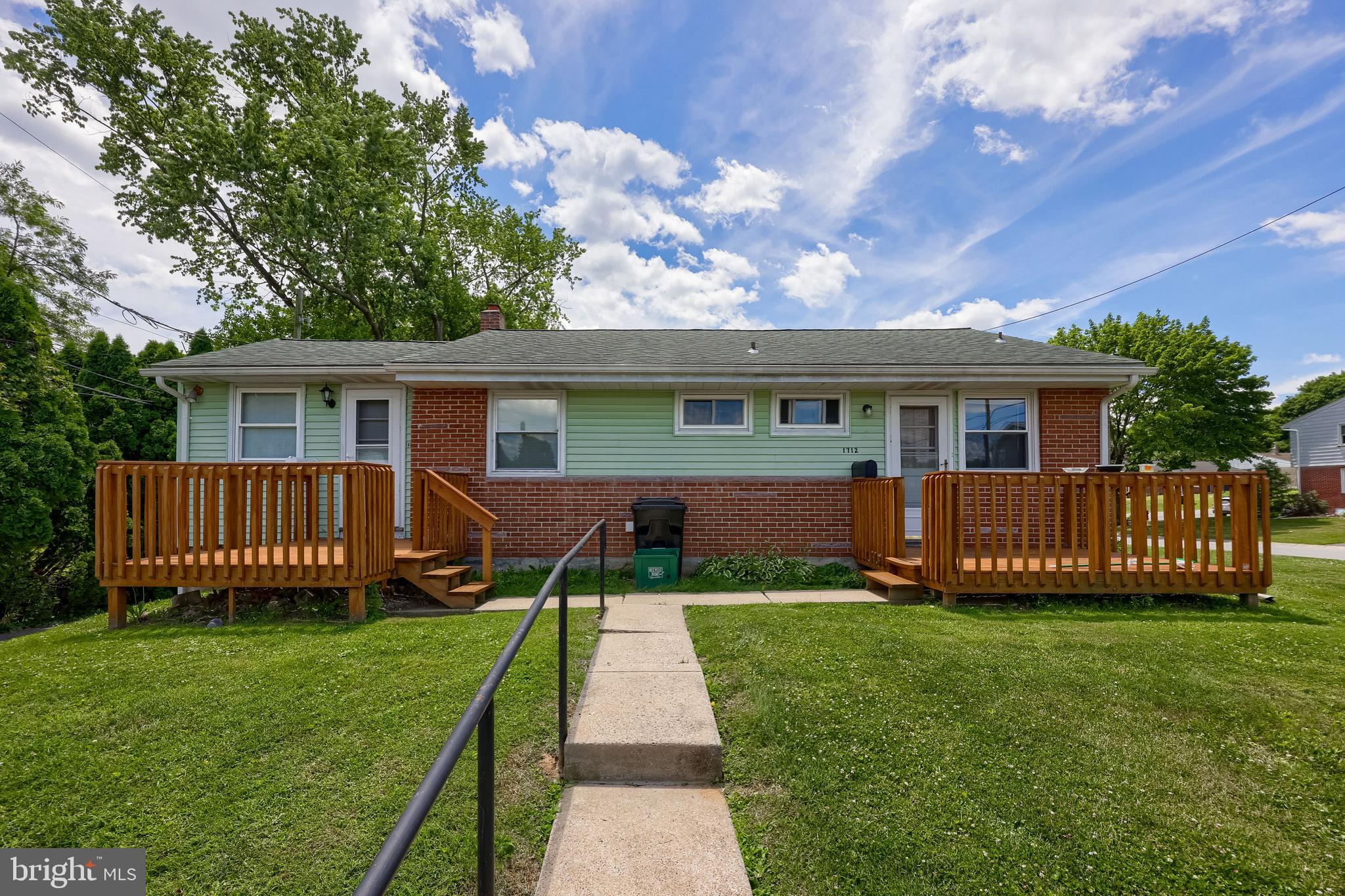 Welcome to 1710-1712 Temple Avenue, a well-maintained side-by-side duplex offering an outstanding investment or owner-occupant opportunity in Manor Township. Situated on a corner lot and backing to mature trees, this property features two thoughtfully designed one-bedroom, one-bath units, each with its own private entrance, dedicated front deck, and comfortable living space. Both units are currently tenant-occupied on month-to-month leases, providing flexibility for future owners.

Each residence offers a bright and functional single-level layout featuring a spacious living area, well-appointed kitchen with range and refrigerator, comfortable, spacious bedrooms, full bath with tub/shower combinations, built-in storage spaces, and abundant natural light throughout. Insulated windows, window treatments, and practical floor plans create inviting spaces that are easy to maintain and attractive to tenants alike. Front decks provide each unit with its own outdoor retreat, perfect for relaxing and enjoying the surrounding neighborhood.

The property sits on a manageable corner lot with mature trees to the rear, offering a pleasant setting while remaining conveniently close to shopping, dining, parks, schools, and major commuter routes. Exterior improvements include gutters, exterior lighting, sidewalks, and paved off-street parking with a four-car driveway, providing ample parking for residents and guests.

Whether you're looking to expand your investment portfolio, live in one unit while generating rental income from the other, or add a solid income-producing property to your holdings, 1710-1712 Temple Avenue presents an exceptional opportunity in a convenient Lancaster County location. Schedule your private showing today!