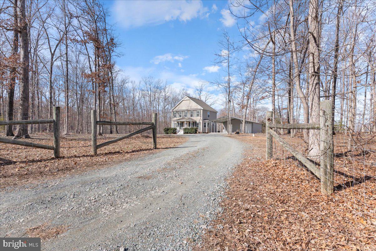 Charming Open Floor Plan Home in the Country! Welcome to your dream home with approx. 1500 sq. ft. on 2.6 acres of serene countryside!  Enjoy the large living room, and open concept dining & kitchen area, perfect for entertaining guests or spending quality time with family.  Huge 24 X 45 Detached Finished Garage & Open Carport Combo: Ideal for a home office, studio, game room, or guest suite. The possibilities are endless! This property offers plenty of space for outdoor activities, gardening, or simply enjoying nature. Move-In Ready and designed for comfort. Don't miss out on this fantastic opportunity to own a piece of country paradise with High Speed FiberLynk internet.  Home warrantee included with full price offer! Contact us today for more information or to schedule a tour.