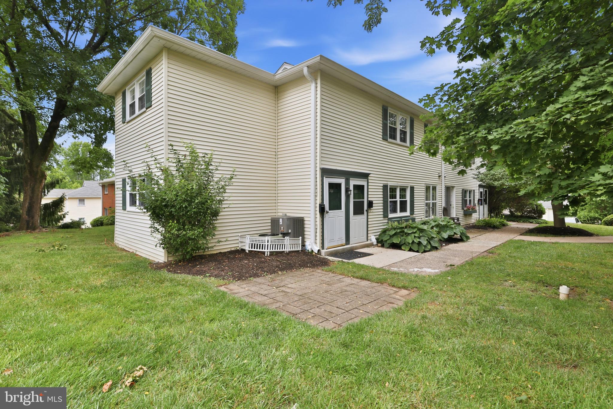 Welcome to this bright and inviting second-floor corner condo in the highly desirable Yardley Commons community! Offering 1 bedroom plus a versatile den, this well-maintained home combines comfort, convenience, and a fantastic location just minutes from the heart of Yardley Borough. Inside, you'll find a light-filled interior with neutral décor, carpeting, and beautiful parquet hardwood flooring throughout much of the home. The dining area is accented by an exposed brick wall that adds warmth and character. The kitchen features abundant cabinetry, additional counter space, and thoughtful custom touches that make everyday living and entertaining a pleasure. The spacious primary bedroom includes dual closets, while the versatile den is ideal as a home office, guest room, or hobby space. The full bathroom provides ample storage, and the convenient in-unit washer and dryer make laundry day effortless. The condo fee includes access to the community pool with annual pool passes, exterior building maintenance, landscaping, water, and sewer, making for an easy, low-maintenance lifestyle. Just a short stroll to the charming shops, restaurants, and parks of Yardley Borough, as well as the SEPTA train station with service to Philadelphia. Convenient access to I-95, Route 1, and Princeton makes commuting a breeze. Whether you're looking for your next home or an excellent investment opportunity, this charming condo offers exceptional value in one of Bucks County's most sought-after communities. Don't miss your chance to own in the heart of it all!