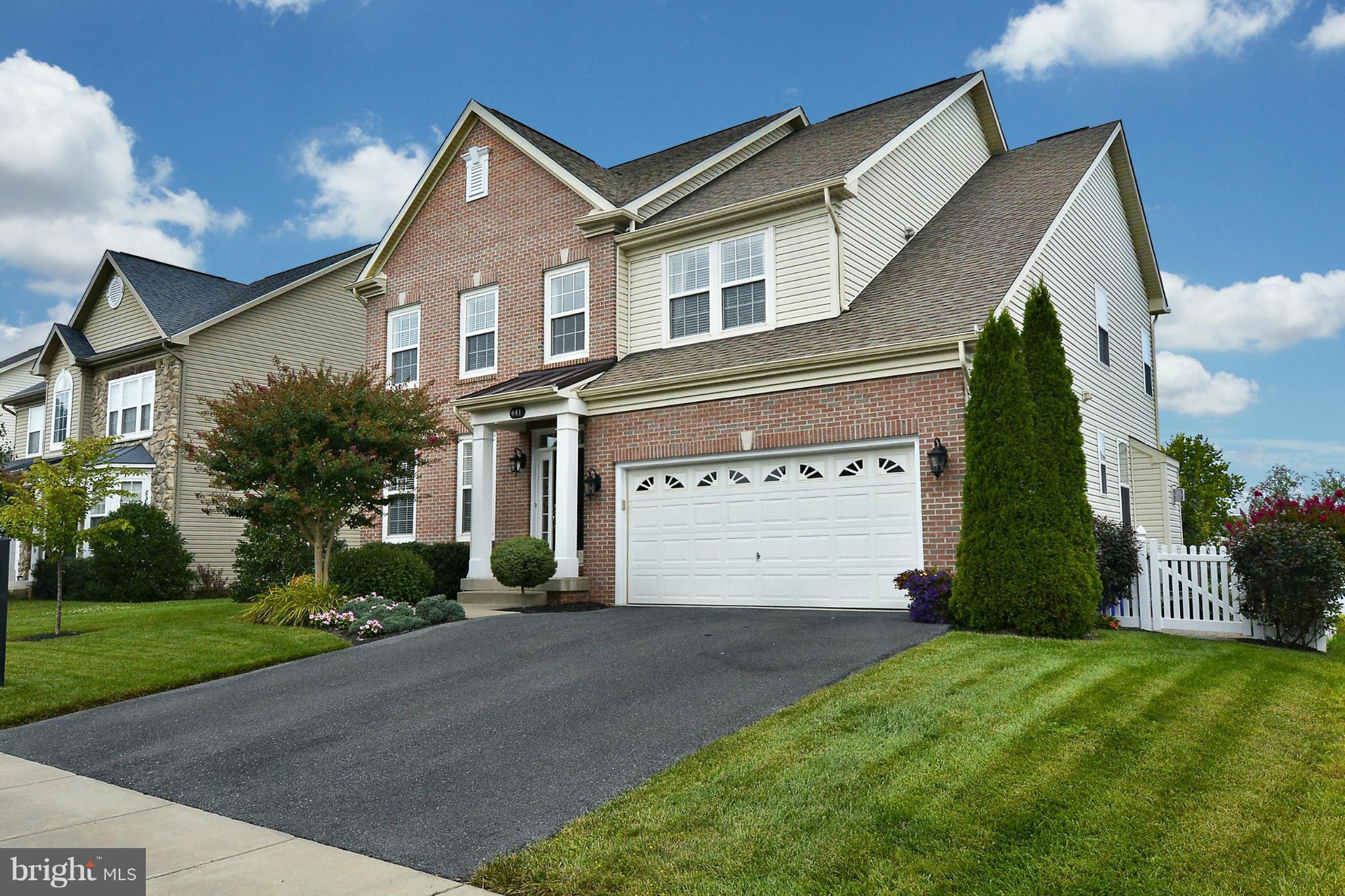 Hurry, hurry!  This impressive gem is completely ready to move in condition and shows beautifully! Just installed neutral Luxury Vinyl Plank flooring makes the entrance and main level look completely modern! With 9 foot ceilings, a wide two-story entrance and the staircase in the rear of the floorplan, the front living room and dining room make for perfect entertaining. A  chef-sized kitchen comes complete with granite counters, backsplash and stainless steel! Lots of sunlight makes the table area feel very spacious and is completely open to the family room with a stone fireplace!  Walk out the back onto a trex deck that leads to a great patio space and your fenced rear yard.  Because the home backs to trees, you'll enjoy warm evenings in private.  On the upper level, the massive primary suite has cathedral ceilings  with accompanying spa bath. Three addtl. bedrooms and hall bath show like a model home. Enjoy the finished basement w/xtra room for fitness or a guest suite, full bath and more! The builtins convey and make the basement a great place to hang out or relax.  In-ground sprinklers allow for low maintenance exterior! And a NEW ROOF installed 2018 and full lower level renovation 2017. Main level flooring brand new! Walk to downtown Frederick and enjoy concerts and more!  Or enjoy easy access to major commuter routes and Wegmans, Shopping and restaurants.This home has it all so don't delay!