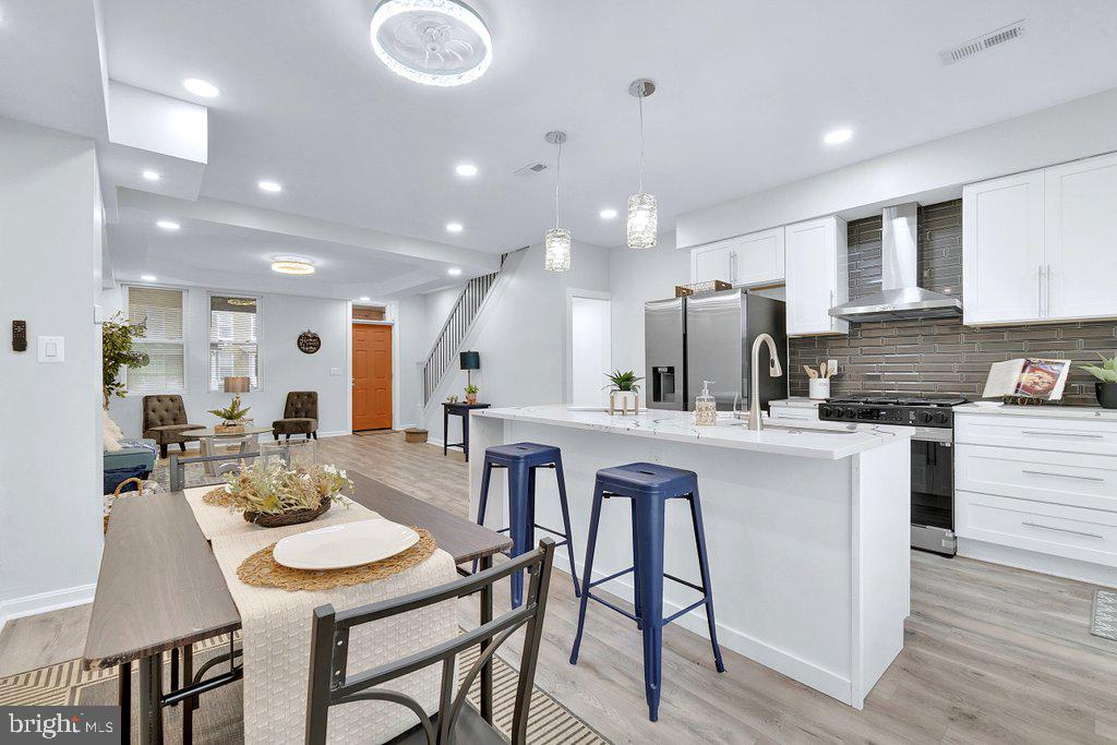 You are going to Love this Fully Renovated 3 Level Interior Brick Porch Front Brick Townhome, with many stylish amenities including Wide Open Floor Plan, Quartz Countertops with Waterfall accent on the Center Island, Barn Doors Accent in Primary Bedroom, 9+ foot Coffered Ceiling, Luxury Vinyl Plank Flooring,  Exquisite Light Fixtures, Rear Parking Pad.  This home features the Charm of Yesteryear blended with the  Modern Updates of Today.  Located a mile from Johns Hopkins Hospital, close to Clifton Park Golf Course and across the street of the Enoch Pratt Free Library which is only minutes from Downtown Baltimore Various Grant Monies Available,  See how you can qualify today for down payment and closing cost assistance....