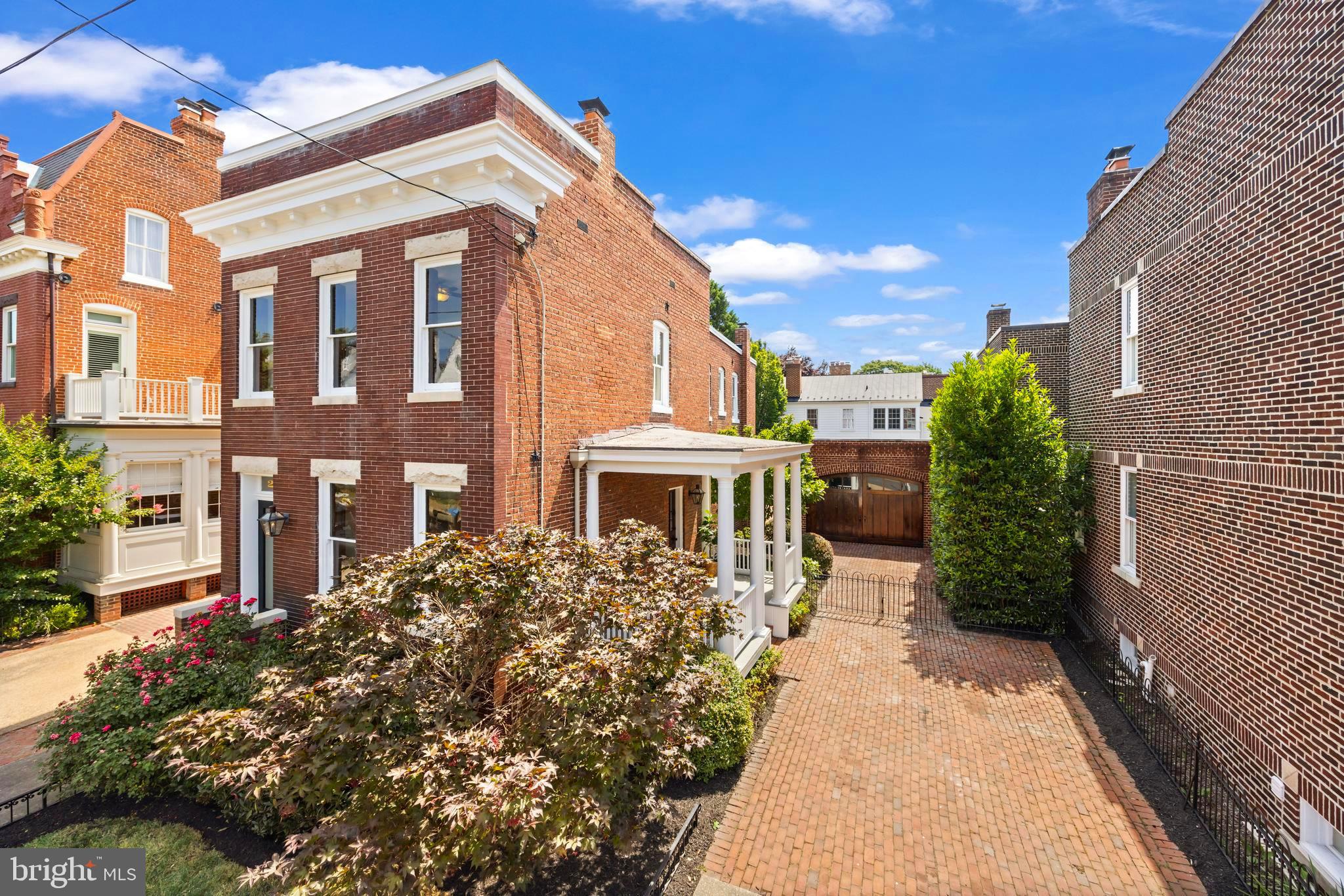 One of the most admired homes in Old Town offered publicly for the first time! 226 S Fairfax Street is an all-brick, fully detached historic home perfectly sited on one of the most sought after blocks in the Southeast Quadrant of Old Town, just two blocks from King Street and only 3 blocks to the waterfront! This truly unique property sits on a double lot with a combined 0.10 acre, and offers a rare detached oversized garage for 2 cars, plus an additional brick driveway for off-street parking that can accommodate 3 additional vehicles. The all-brick detached garage was constructed to mirror the age of the home in materials and design and features gorgeous solid wood, carriage house style double doors (and has power!). The wide covered side porch and the fenced backyard and brick patio offer incredible outdoor space for peaceful relaxation or entertaining family and friends. The home presents the perfect blend of historic charm coupled with modern finished and conveniences. Throughout the interior are exposed brick walls, beautiful original hardwood floors, 9ft+ high ceilings, fresh neutral paint, and large windows allowing the living spaces to be flooded with natural light. The main level includes a formal living room with decorative fireplace mantel, updated powder room and kitchen, and a large dining room that can also be used as an additional living space. The light-filled kitchen features stainless-steel appliances, under-cabinet lighting, gas cooking, and a side door to the breezeway connecting the home to the patio and garage. For ease and convenience, the kitchen also offers an additional staircase up to the bedroom level at the rear of the home. High ceilings, exposed brick and hardwood floors continue onto the upper level, hosting three bedrooms and two renovated full bathrooms, each with glass-enclosed showers. Charming gas lanterns around the exterior of the home add to its historic charm while the huge flat, brick patio + flat green space offers privacy in the heart of the city. The lower level, unfinished basement is ideal for storage and features a cellar exit. Dual zone HVAC. Waterproofing system in basement. Historic windows convey as-is. Don't miss this incredibly rare opportunity to be the 4th owner of this historic residence!