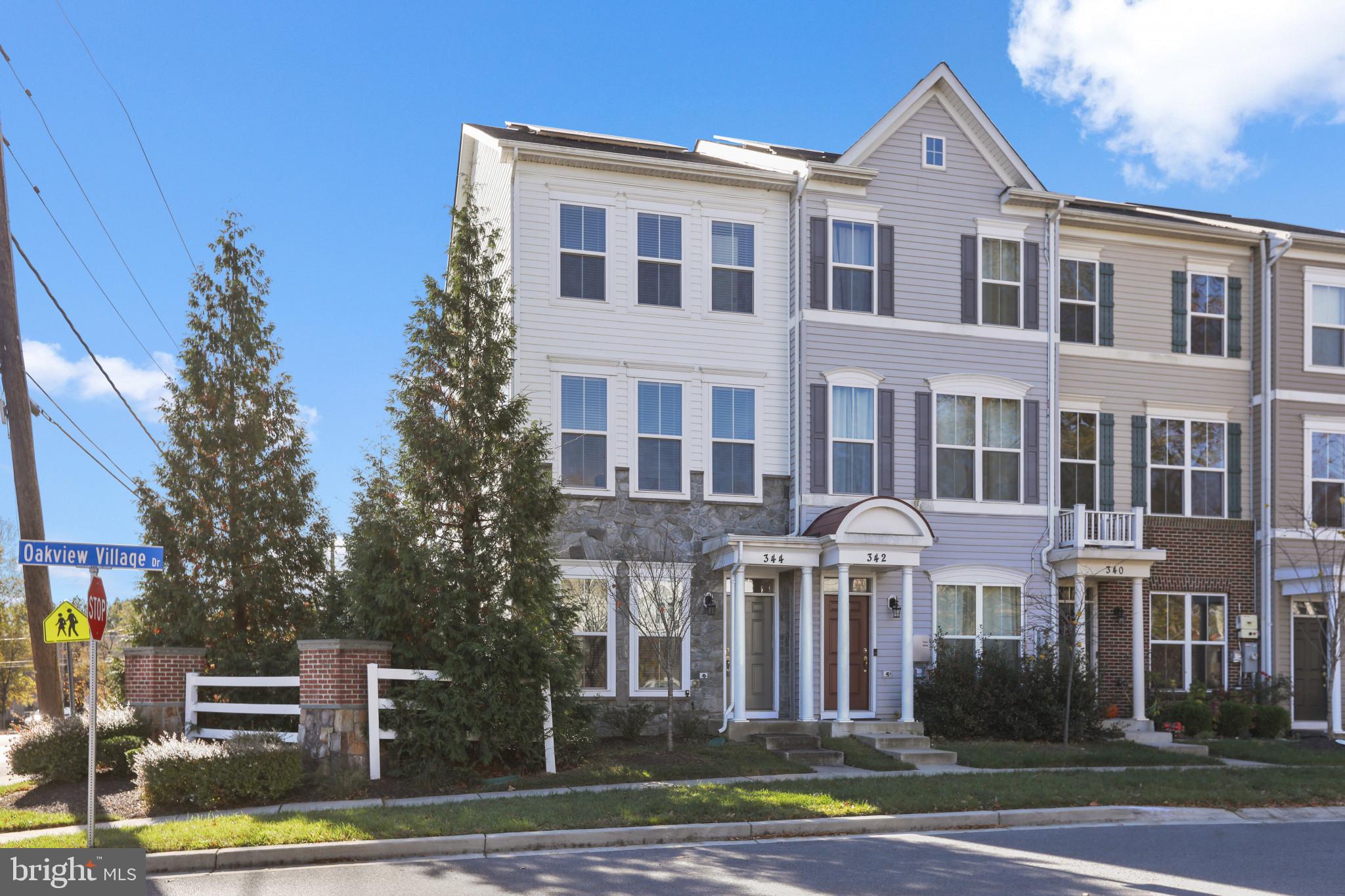 3 story contemporary end-unit townhome in Oakview Village available now! A gated community in an ideal location within 1 mile of Baltimore Washington Medical Center & minutes to BWI Airport. It’s spacious and comfortable, luxurious and affordable with a bright & open floor plan, with vinyl plank flooring, center island, GE stainless steel appliances & 42" wood cabinetry. Sliding glass doors lead to your deck off the kitchen. Oversized living room to entertain your guests and a separate eat in kitchen area along with breakfast bar seating. Two spacious bedrooms on the upper level, each having their own private full bath. Lower level rec room/office/exercise room or optional 3rd bedroom with a 1/2 bath and laundry room. One car garage with rear entry . Well maintained & no maintenance! The HOA amenities include: open play areas, tot lot, gazebo, conversation fire pit area with adirondack chairs & lawn maintenance. Solar panels are eco-friendly and cost-efficient power source. Enjoy all the benefits of low utility bills. Easy access to 97, 100 & Rt 50. Short commute to Fort Meade/NSA, Baltimore, DC, Annapolis.  Schedule a private tour today!