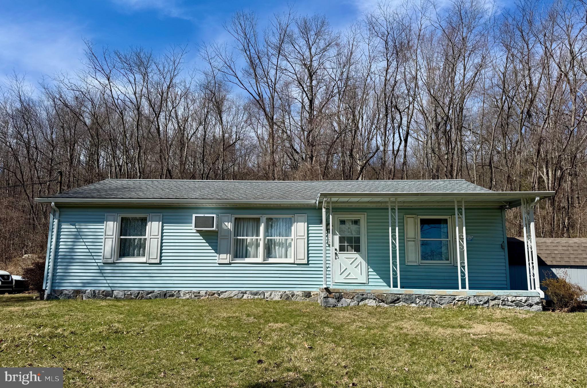 Welcome home to this well-maintained 3-bedroom ranch, nestled among tall, whispering trees in a private setting.  Featuring 2 full baths and main floor laundry, this home offers both comfort and functionality. Enjoy the screened-in porch, perfect for sipping coffee on a crisp spring morning or unwinding with a glass of wine after a long day. With breathtaking scenic views for miles, this home also includes a shed for extra storage. This won’t last long-hurry before it’s too late! Highest and best offers due by Monday, March 31st, at 6:00 p.m.