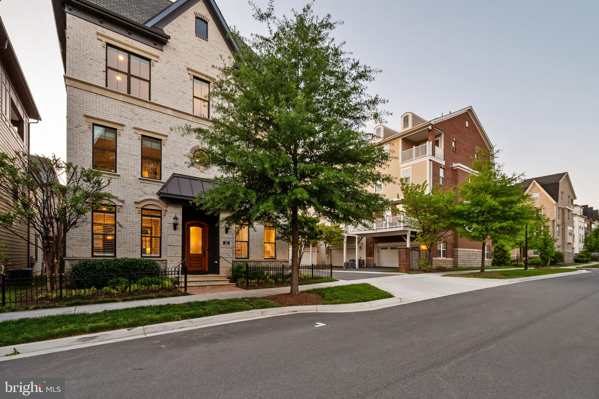 Showings will begin Friday 5/1 at 2pm.  

Rare Opportunity!!! Welcome to 311 Strummer Ln, a Stunning 3 Level City Home with Elevator in Downtown Crown…311 Strummer is one of the most desirable homes in Crown, Montgomery County’s most vibrant mixed-use community, these rarely hit the market!

This elegantly finished 3 level Wormald built Alexandria City Home offers luxury indoor and outdoor living in the heart of it all—complete with a private elevator, top-tier upgrades, and an unbeatable walkable location just 3 blocks from Downtown Crown's bustling shops and restaurants. Features You’ll Love: 

* 4 Bedrooms | 3 Full, 2 Half Bathrooms | Elevator | 2-Car Garage * Spacious open-concept layout with wide plank hardwood floors * Gourmet kitchen with Quartz countertops, Viking stainless steel appliances, pot-filler, instant hot water, an oversized island with seating, and added beverage bar* Inviting great room featuring a striking gas fireplace * Beautiful * Flexible Main-level space incased with sliding glass Barn doors—ideal for a home office * Luxurious 2nd-level owner’s suite with a spacious layout, sitting area, 2 custom walk-in closets, and spa-inspired bathroom with soaking tub, dual vanities, and glass walk-in shower with rain shower head*This model is standard as a 3BR, but seller added 4th bedroom as an option, as more bedrooms offers more flexibility in the home* Private Elevator to all 3 floors! * Top-floor bonus/media room w/ full wet bar, and the rooftop terraces of all rooftop terraces. This is an Entertainers Mecca. The rooftop terrace sprawls over 1,000 SqFt, partially covered and partially uncovered. You have room for every entertainment device out here; From grills/black stones and smokers to and an outdoor bar, outdoor TVs, lounge furniture, a sectional, dining table and fire pit. You name it, and it can fit on this rooftop! *Rooftop also equipped with natural gas and roughed in for an outdoor kitchen w/ plumbing and water* Garage upgrades include a custom Polyurea floor coating, Level 2 EV Charger and storage rack systems  * Custom window treatments throughout the home. *All the bedrooms, family room, office, Rec room, and rooftop are wired for Ethernet

Crown Community Amenities: Living in Crown means having everything you need just steps from your front door. From casual restaurants to fine dining, gyms to luxury spas, coffee shops, banks, and boutiques, it’s all here. And perhaps the biggest convenience of all: Harris Teeter grocery store is just a short walk away. Residents also enjoy access to "The Retreat," Crown’s exclusive community clubhouse, featuring a resort-style pool, fitness center, yoga studio, lounge areas, and event space. With low HOA fees that include lawn and community maintenance, plus a shuttle to the Metro, every detail has been thoughtfully designed for effortless living. Located just 2 minutes from RIO, I-270, and the ICC, this is the perfect place to call home. Luxury, convenience, and community—this is Crown living at its best. Schedule your showing today.