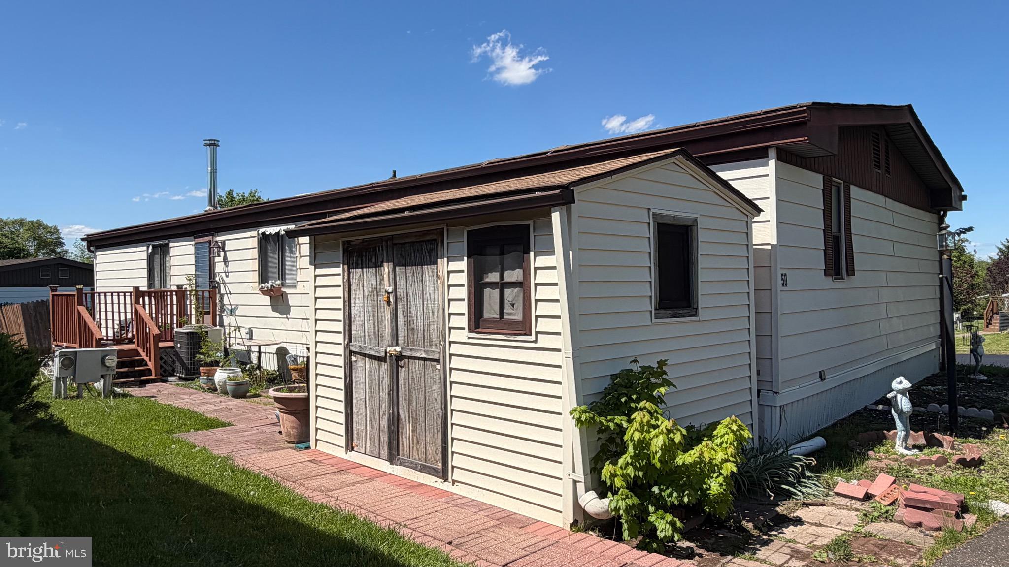Priced to sell and ready for its next story, this 3 bedroom, 2-full-bath double-wide manufactured home is a rare find in one of the area's most sought-after 55+ communities. Offered as-is, this is an exceptional opportunity for the buyer with a vision and ready to add their personal touch, build instant equity, and settle into a location that truly delivers on lifestyle. Single-floor living at its finest with no stairs, no fuss, just comfortable and convenient everyday life in a warm, welcoming neighborhood. Speaking of lifestyle the brand new 2025 Clubhouse is nothing short of stunning, featuring a massive community gathering room, a quiet library, a state-of-the-art fitness center, and a beautifully appointed Hearth Room perfect for cozy evenings. Step outside onto the sweeping porch lined with rocking chairs overlooking the sparkling pool. Your monthly ground fee covers it all: clubhouse access, community events, pool, trash, sewer, snow removal on main roads, land taxes, and even a bus shuttle for weekly community trips.
Location couldn't be more ideal. Nestled along the Rt. 309 corridor with effortless access to shopping, dining, and entertainment. A short drive puts you in the heart of Philadelphia, the charming towns of Doylestown, Ambler, Hatboro, and Conshohocken, plus easy Rt. 309 and PA Turnpike access to parks and museums throughout the region. This is your chance to plant roots in a vibrant, active community at at a price that makes it possible.