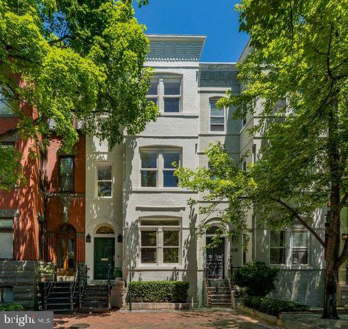 FIRST OPEN this SATURDAY, June 6th from 1pm to 3pm.  Stunning top to bottom renovation of this charming light filled 5 bedroom 4.5 bath Federal in the heart of Georgetown.  Every detail has been thoughtfully attended to from the high ceilings, custom finishes, designer lighting, wide plank wood flooring and captivating floorplan. All new electrical, plumbing, all chimneys relined, new roof, new windows, new flooring throughout, all new bathrooms and kitchen.  The main level offers a formal extra wide living room with fireplace and alcove, separate dining room, stunning gourmet kitchen opening to a fabulous entertaining patio, and completed with a main level powder room.  Upstairs on the second level  one is welcomed with an inviting primary suite with fireplace, incredible wardrobe space and elegant primary bathroom.  A second bedroom and second  full bath complete this level.  On the third floor, two additional bedrooms, (one the size of the primary below it), a third full bath, second laundry and exciting rooftop deck will delight the senses.  The daylight walkout lower level accessed from within the home is a suite unto itself, with a full bedroom, sitting room, living room, laundry and full bath along with its own outside entrance.  Hurry this one is special!