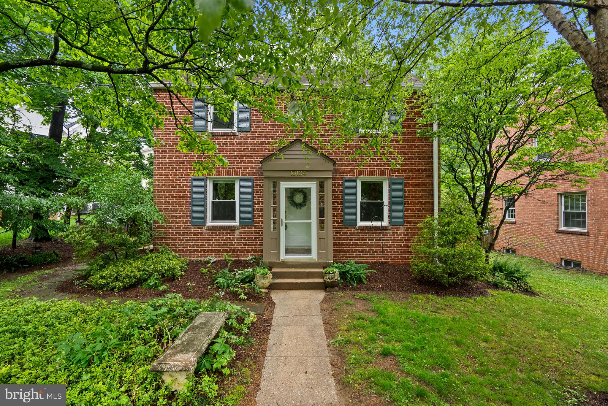 Open Sunday, May 18 from 1 PM to 3 PM . Welcome to 10104 Big Rock Road, a charming colonial nestled in the sought-after Woodmoor neighborhood and perfectly positioned adjacent to the Northwest Branch woods and trails. This light-filled home blends traditional character with modern updates, featuring hardwood floors and freshly painted walls throughout. The main level offers a spacious living room with a wood-burning fireplace and access to the side yard, a formal dining room with classic chair railing, and an updated kitchen with cherry wood cabinets, stainless steel appliances, and granite countertops. Step out from the kitchen to a deck and patio that overlook a serene, tree-filled backyard—ideal for outdoor entertaining. Upstairs, you’ll find three bedrooms and a beautifully renovated full bathroom with a glass-enclosed shower. The lower level includes a  family room and a utility room with laundry and storage space
Living in Woodmoor means more than just owning a beautiful home—it means being part of a vibrant community. The Woodmoor Citizens Association (not an HOA) hosts many events: 
Woodmoorstock- music festival in June
Oktoberfest 
Christmas Tree and Menorah lighting
4th of July Parade