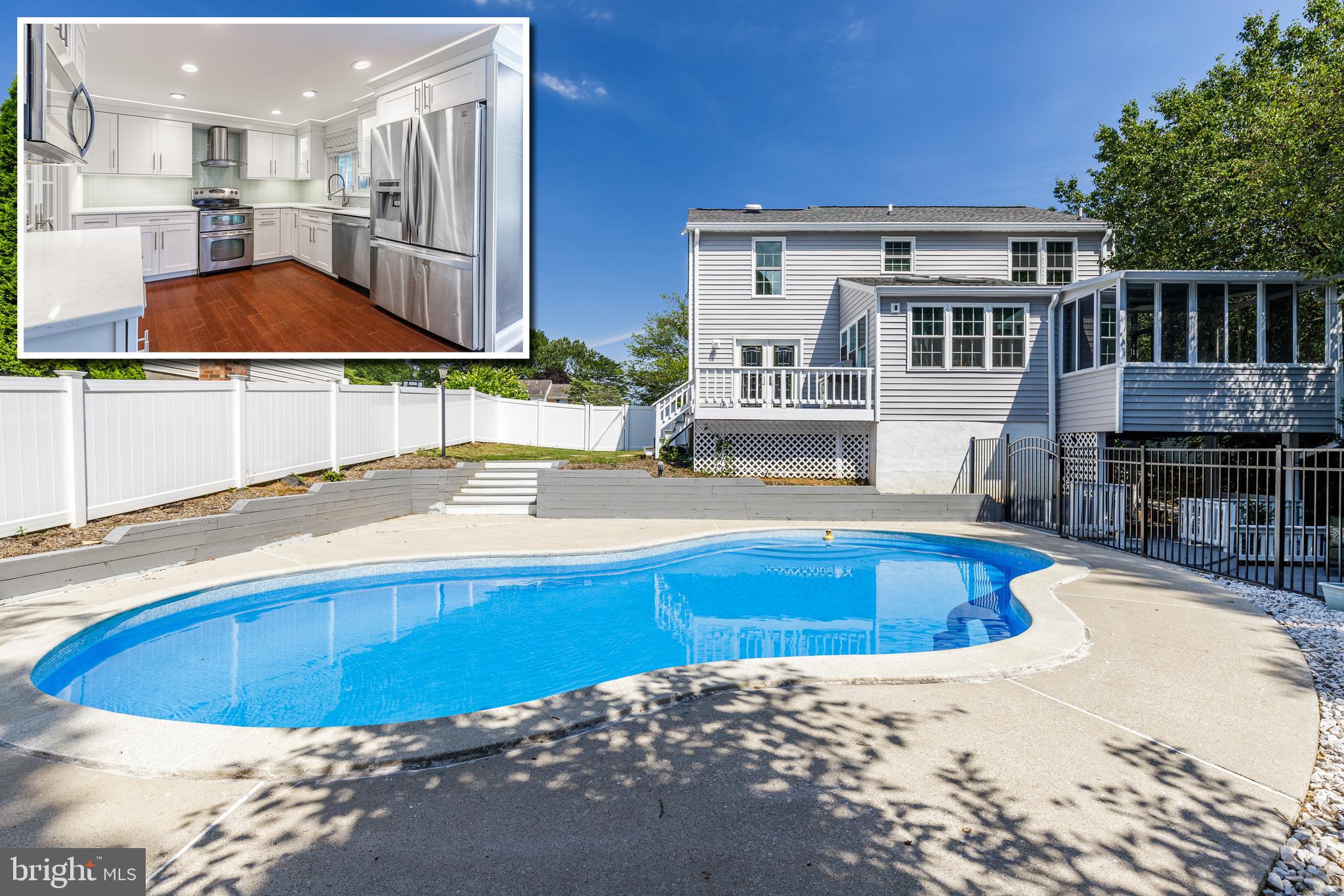 SPECTACULARLY DESIGNED COLONIAL WITH OVER 2,300 SQ. FT. OF LIVING SPACE AND A BACKYARD THAT'S BUILT FOR ENTERTAINING! The main level features gleaming hardwood floors throughout, a formal living room and separate dining room w/ wainscotting, a Chef inspired gourmet kitchen w/ Quartz counters, ss appliances, glass tile backsplash, tons of cabinet space, and a sundrenched breakfast area, half bath, and an enclosed porch with wall to wall windows.  The upper level offers a generous Master suite w/ vaulted ceilings and spa bath with attractive soaking tub and a glass enclosed shower.  2 additional bedrooms with a hall bath complete this level.  The basement is finished with a family room, full kitchen, 4th bedroom, and 3rd full bath - perfect for an in-law suite.  The rear yard offers multiple areas to entertain including a covered porch, 2 deck areas, and a large in-ground pool!
