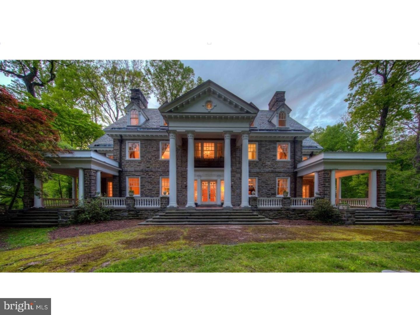 Designed by the Philadelphia firm of Savery & Scheetz for its wealthy industrialist namesake, the Houstonia mansion impresses at every turn. No detail was spared in this 22-room estate - you'll find all of the grace and charm of the time period intact with tasteful and modern updates, making the home both a lovely endeavor in preserved history and well suited for today's discerning buyer. With an incredible amount of original architectural elements whose quality in craftsmanship and detail is a rarity in today's builds, the home is quintessentially Neoclassical. Ascend the bluestone terrace with Juliet balcony & soaring 2-story portico & discover its grandeur. French doors open onto a magnificent reception hall, whose wide stair & Palladian window half-story landing fills the space below with natural light. Gleaming hardwood floors, handsome wainscoting, detailed millwork, pocket doors, stunning light fixtures & quality materials set the tone for this home.  A very large, full-depth living room with gorgeous soapstone hearth fireplace is located to the hall's left. It serves as a lovely gathering room, providing access to both the terrace & sunroom. To the right of the center hall, you'll find the office & an arched passageway to the home's beautiful dining room with a second soapstone hearth fireplace. The generously-sized butler's pantry with wine refrigerator & kitchen with gorgeous cabinetry, stainless steel built-in kitchen aid appliances, huge island, and many gourmet amenities! A breakfast room is located just beyond the kitchen & makes a lovely transition to the back stair hall. These stairs provide convenient & informal access to the bedroom wing above; here you'll find 5 bedrooms, 3 full baths, laundry & stair access to the 3rd story. Continue across the main stair hall to find the sizable owners suite with en suite bath, large dressing room & access to the sleeping porch. The finished 3rd story includes another bedroom, bonus rooms, walk in cedar closets, another full bath and billiard room. A large, detached carriage house with three heated garage bays is located on a separately deeded tax parcel and is included with this property. The carriage home residence serves perfectly as an in-law/Au-Pair suite, or a rental. Recently refinished floors throughout, it boasts an eat-in kitchen, great room, family room, 2 bedrooms, hall bath and deck. Five acres of gorgeous grounds, Houstonia is surrounded by an oasis of township parkland in Wallingford.