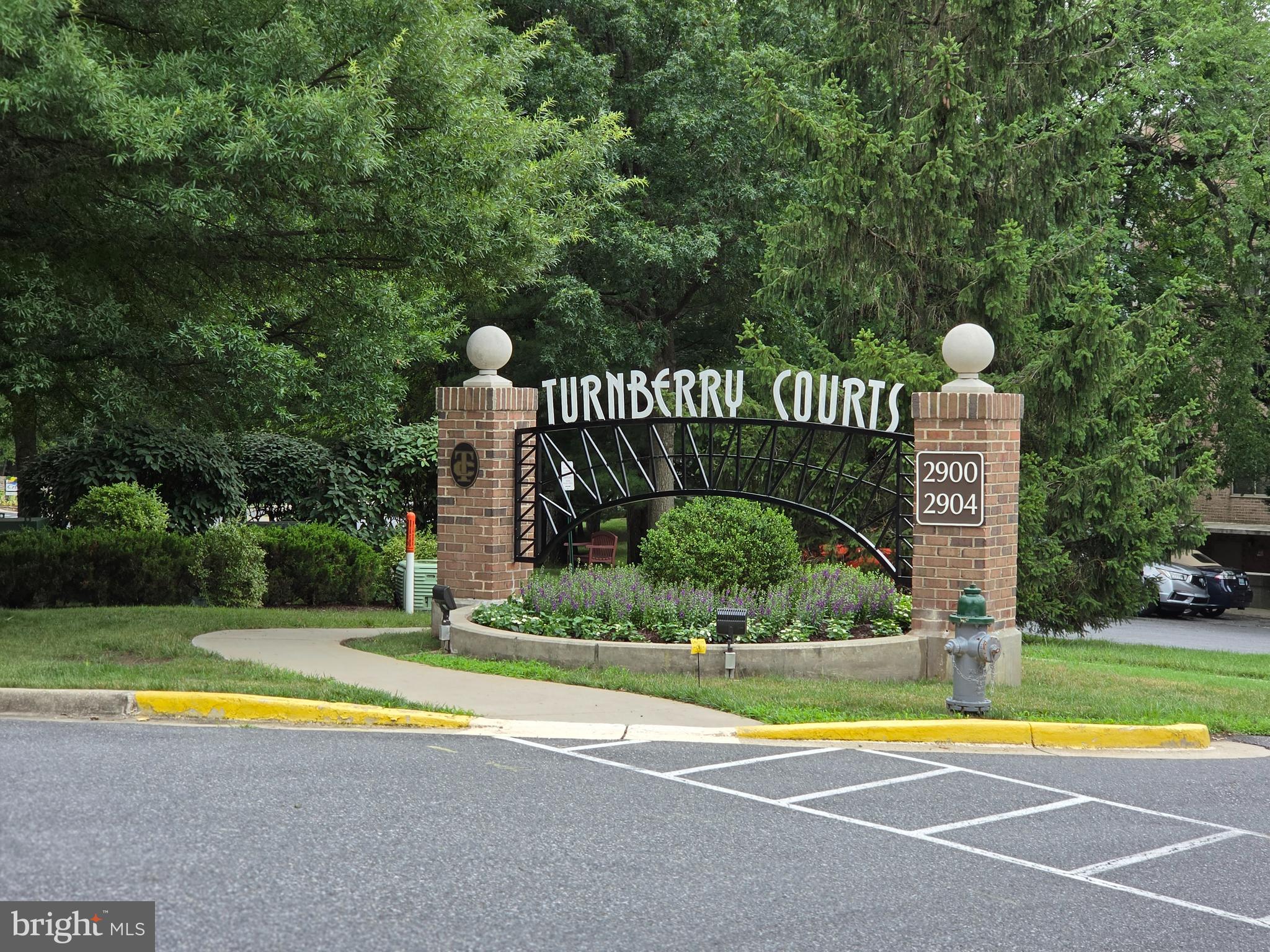 Age 55+ Adult Community.  Welcome to Turnberry Courts at Leisure World, one of the community's most active and desirable buildings.  This spacious two-bedroom, two-bath condo ("T" Model) with a large den/library offers a bright, flexible floor plan, secure building entry, an indoor garage parking space and a private storage cage in a dedicated, temperature-controlled area.  
Freshly painted and move-in ready, the home features beautiful red oak hardwood floors, generous natural light, a renovated kitchen with stainless steel appliances to include a Top of the line - GE Profile Refrigerator installed in 2025, quartz countertops, and a large window.  The separate dining and living areas provide comfortable space for everyday living and entertaining, while sliding doors open to a four-season enclosed porch that extends the the living area.  
The primary bedroom includes a large walk-in closet with built-ins and an updated bath with both separate shower and tub.  The second bedroom is located near the second full bathroom and is located on the opposite side of the condo, offering privacy for guests or a home office setup.  The HVAC was replaced in 2018.   
Leisure World offers exceptiojnal amenities, including indoor and outdoor pools, fitness center, award winning golf course, tennis courts, restaurants, walking trails, shuttle service, clubs, activities, and an on-campus MedStar Health Center.  Turnberry is a no-smoking community known for its active social calendar, including lecture series, museum and theater trips, coffees, happy hours, and resident events.