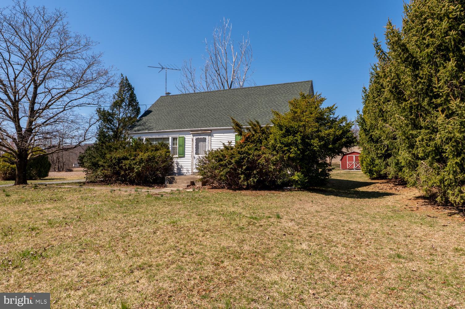 HIGHEST & BEST OFFERS DUE 4/8 BY 9 PM.  Attention investors and handymen! This cute home in desirable East Penn school district is awaiting your personal touches to bring it back to its original charm. The living room is bright and spacious and leads to a roomy eat-in kitchen. Down the hall are two bedrooms as well as a full bath. The enclosed back porch is perfect for morning coffee and watching wildlife in your backyard and nearby fields. Upstairs are two more bedrooms with wooden sloped ceilings. A full unfinished basement with an outside entrance allows plenty of space for storage and laundry. The home sits on nearly a half-acre, is surrounded by farmland, and offers a fantastic opportunity for a new buyer to personalize and update it to match your tastes. Easy access to major routes, schools, hospitals, and shopping.