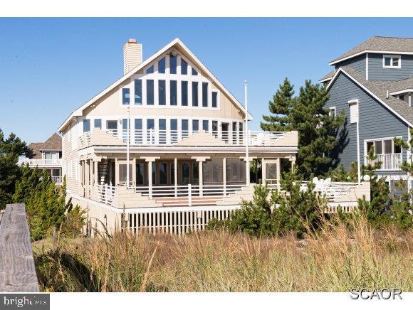 OCEANFRONT! Enjoy Extraordinary Ocean Views From Almost Every Room Of This 5BR,5BA Home. The Open Floor Plan, Multi-Level Decks, Screened Porch, & Private Beach Access Make This Home Perfect For Summer Entertaining.  Situated In The Sought After Gated North Bethany Community Of Breakwater Beach.