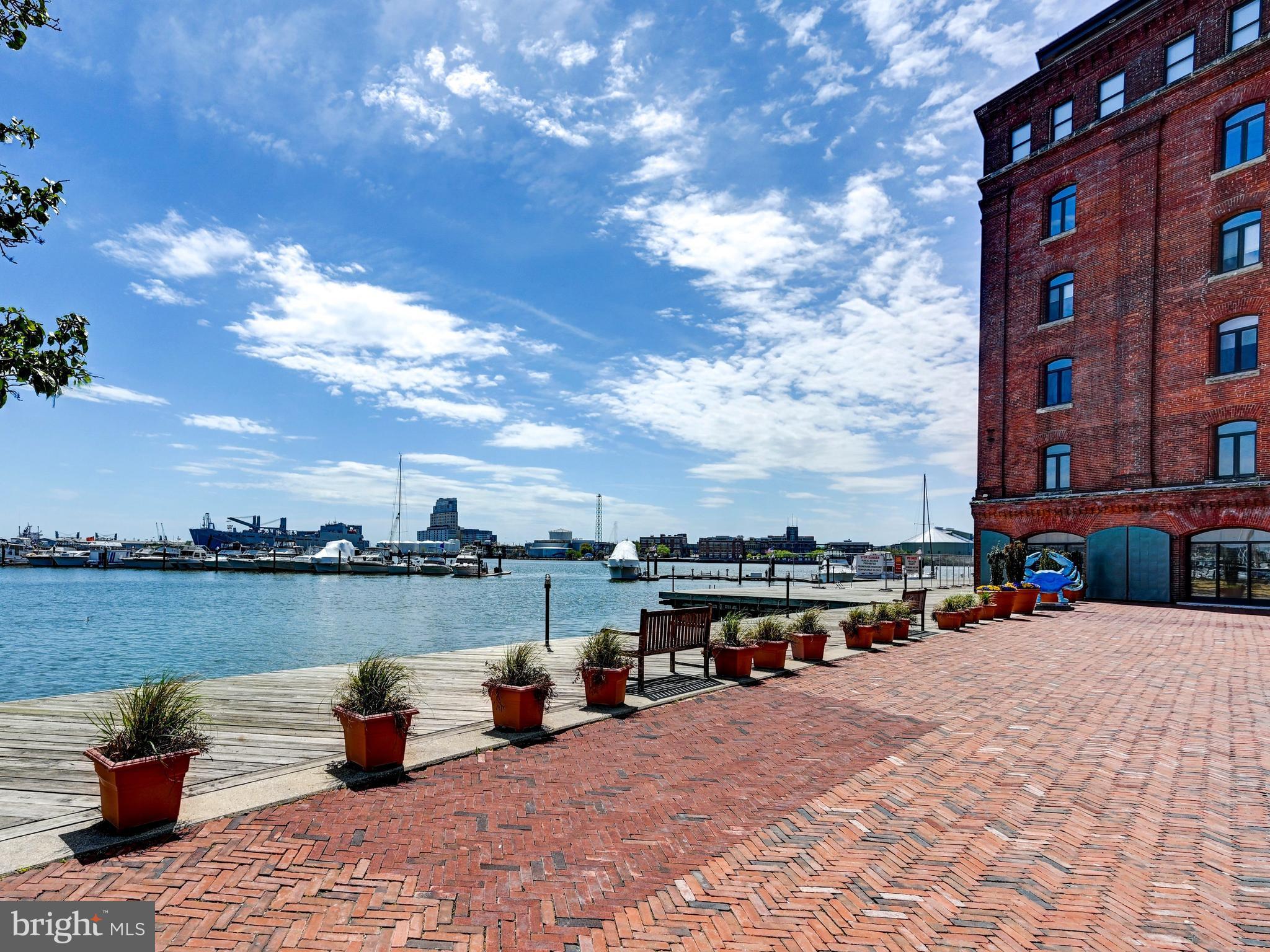 Welcome to 1000 Fell Street #411—where historic charm meets modern urban living in the heart of Fells Point. Nestled along Baltimore’s iconic waterfront, this beautifully updated 1-bedroom, 1-bath loft-style condominium offers the perfect blend of character, convenience, and style.

Step inside to discover an open, airy layout highlighted by stunning exposed brick and oversized windows that fill the space with natural light overlooking the English garden courtyard. The home features new hardwood throughout and a thoughtfully updated kitchen featuring modern finishes, sleek cabinetry, and ample counter space—ideal for both everyday living and entertaining. The renovated bathroom offers a clean, contemporary feel that complements the home’s historic charm. The spacious loft-style bedroom provides a comfortable retreat, while the overall design maintains a perfect balance of industrial character and modern upgrades.

Enjoy the convenience of one included garage parking space, a true luxury in this vibrant, walkable neighborhood. Just steps from the waterfront promenade, renowned restaurants, boutique shopping, and lively nightlife, this location offers the very best of city living.

Whether you're seeking a full-time residence or a stylish city getaway, this exceptional property delivers the quintessential Fells Point lifestyle.