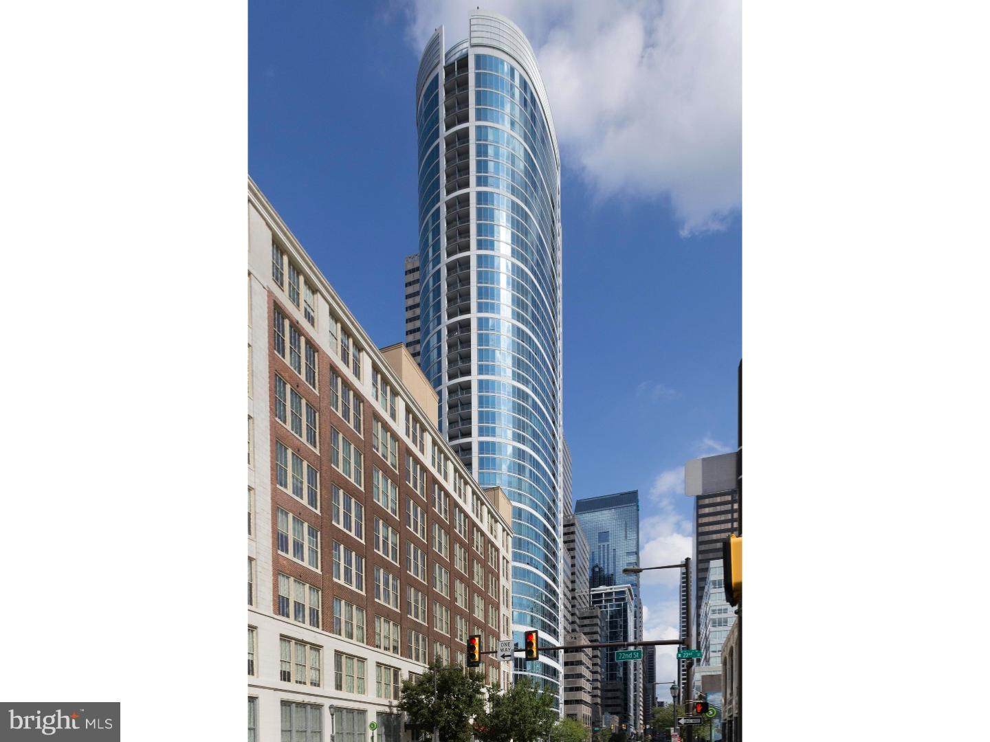 Enjoy expansive views and high-end design features in this award-winning home at the Murano Condominiums.The current homeowners, with the help of local architectural interior designer Carlo Fiammenghi, created a unique floor plan by combining 2 units on the 28th floor. The condo was designed with a contemporary European flair and won the Silver Dream Home Award 2011. It was also the subject of a feature article in Philadelphia Style magazine. The main floor open layout features more than 2,000 square feet of luxurious living space,  many floor-to-ceiling windows, 2 master bedroom suites, 3 full bathrooms, living room, dining room (which could be converted back to a 3rd bedroom), 2 balconies, full-size main floor laundry, 9-foot ceilings, programmable custom lighting, and ceiling-mounted speakers throughout. Italian glass doors by Lualdi greet you at every doorway and bamboo floors cover the main living area. The recently remodeled kitchen features granite countertops, a matching granite backsplash and new Bosch stainless steel appliances.  The primary master bedroom suite features endless views whether you're relaxing inside or enjoying the private balcony. Beautiful white tile floors adorn the master bedroom. The oversized master walk-in closet is outfitted by Poliform. A master lounge can also double as a home office. A stunning master bathroom with a soaking tub, oversized shower, custom-made vanity and tub surround and heated blue marble floors keep your feet comfortably warm. The 2nd master bedroom offers stunning city views, en suite bathroom and a full wall of custom closets shelves and draws, all tastefully hidden behind Lualdi sliding glass doors. 3 deeded parking spaces and 5 exclusively licensed storage lockers easily satisfy your parking and storage needs. The Murano is an amenity-rich building, which features 24/7-concierge service, an indoor heated lap pool, large sun deck, state-of-the-art fitness center and hospitality room. Do not miss this opportunity to own such a rare condo!