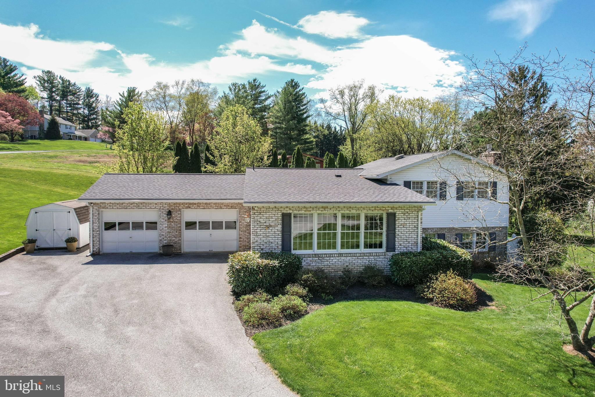 OPEN HOUSE this SATURDAY 11am - 1pm*Welcome to this beautifully updated 4-bedroom, 3-bath custom home with a 2-car garage in desirable Winchester Park*This charming property showcases exceptional curb appeal with a classic brick front, oversized asphalt driveway, pristine landscaping, & two inviting brick patios perfect for outdoor entertaining*Step inside to an open-concept main level filled with natural light, featuring a spacious living room highlighted by an expansive window seat & a formal dining area ideal for gatherings*A true centerpiece of the home is the gourmet kitchen, thoughtfully remodeled in 2012*This stunning space offers high-end cabinetry, under-cabinet lighting, stainless steel appliances, a rustic tile backsplash, & an expansive granite island with pendant lighting that comfortably seats six*The kitchen seamlessly flows into a bright sitting room with easy access to the rear patio, creating the perfect indoor-outdoor lifestyle*High-quality real hardwood flooring & updated lighting enhance the entire main level*Upstairs, the primary suite features hardwood flooring & an updated en-suite bath complete with double vanities & a spacious walk-in tiled shower*Two additional generously sized bedrooms, both with hardwood flooring, & another updated full bath complete the upper level*The lower level offers a cozy yet light-filled family room with a striking brick-walled gas fireplace, along with a laundry room, a third updated full bath, & a true fourth bedroom with direct access to a second patio—ideal for guests or a private home office*Enjoy the added benefits of no HOA & no city taxes, along with a prime location within walking distance to the Ag Center, Farm Museum, Hoffman’s Ice Cream, Friendship Valley sports fields, & Carroll Hospital*For more peace of mind, the roof was replaced in the summer of 2021, both heat pumps were replaced in May of 2023, home was pre inspected & the main electric panel box was upgraded in 2026*This is a rare opportunity to own a thoughtfully updated home in a highly convenient & sought-after setting*