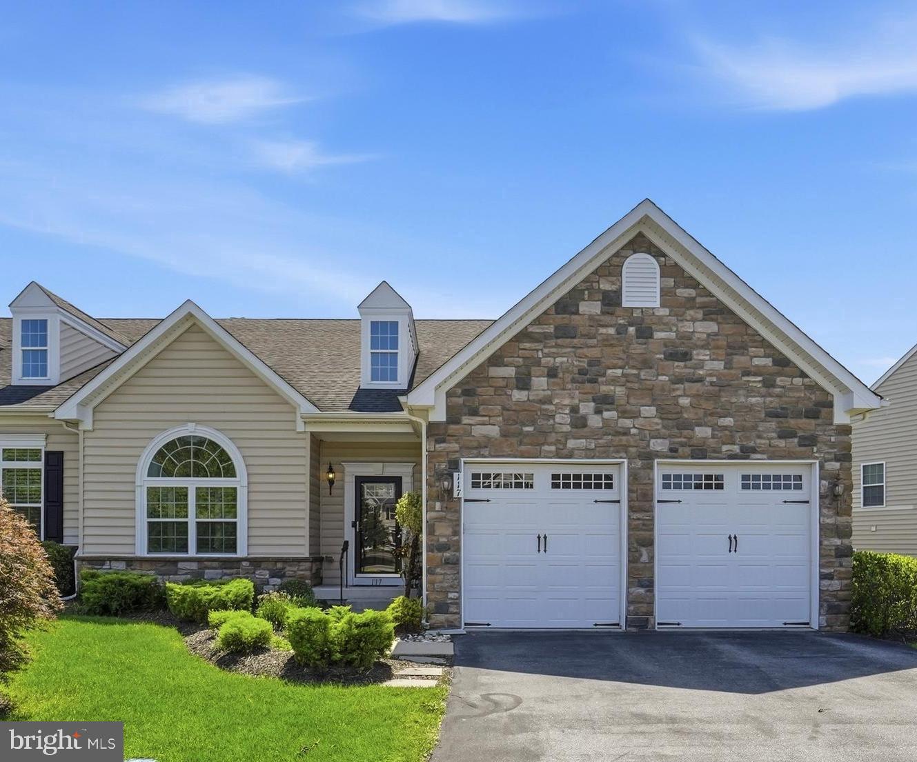 Looking for a relaxed lifestyle in a Gold Star gated community? Welcome to 117 Mustang Way. This beautifully maintained, turn key end-unit carriage home offers three bedrooms, two full baths, and two half baths, and is ready for its next chapter. Located within the highly sought-after Stony Creek Farms community, this exceptional residence blends luxury, comfort, and low-maintenance living in one of Montgomery County's premier active adult neighborhoods.

The welcoming entryway sets the tone for this impeccable home, showcasing an open-concept and versatile floor plan designed for both everyday living and entertaining. The sun filled living room flows seamlessly into the spacious formal dining room and well-appointed eat-in kitchen, featuring abundant cabinetry, expansive granite countertops, and premium appliances. Just beyond the kitchen, you'll find the cozy morning room anchored by a stunning gas fireplace, creating the perfect gathering space. Sliding glass doors from the family room lead to a private deck, ideal for enjoying a morning coffee or unwinding at the end of the day.

The first-floor primary suite serves as a peaceful retreat, offering a spacious bedroom, walk-in closet, and private bath. Upstairs, a gracious landing with a Juliet balcony overlooks the main living area below. Two generously sized guest bedrooms, each with ample closet space, share a hall bath with a double vanity, providing comfortable accommodations for family and visitors alike. A versatile bonus room completes the second floor and is ideal for additional storage, hobbies, or flex space.

Completing the main level is an office enclosed by French doors, a convenient powder room, and a laundry room with direct access to the attached two-car garage.

The expansive lower level offers exceptional versatility, with ample room for recreation, exercise, and entertaining. A convenient half bath and substantial storage space add to the home's functionality.

Step outside and enjoy the tranquil surroundings from your private patio in this beautifully landscaped community. Residents of Stony Creek Farms enjoy an exceptional lifestyle with access to a stunning clubhouse featuring a great room, media room, fitness center, and heated outdoor pool. With three miles of walking trails, mature landscaping, and natural beauty throughout Worcester Township, you'll enjoy a carefree lifestyle just minutes from Skippack Village, Blue Bell, shopping, dining, and entertainment.