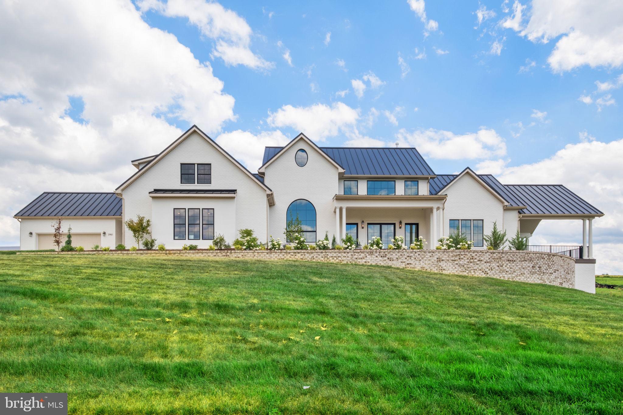 Experience unparalleled luxury in this brand-new custom estate sprawling over 10.49 private acres in Mt Crawford. Offering over 8,900 total sq ft of masterful design, the exterior commands attention with clear-coated travertine stone, painted brick, and a sleek metal roof. Inside, a custom glass entry door opens to soaring 11-to-18-foot ceilings, custom tongue-and-groove trim, and pristine White Oak flooring.
The chef’s kitchen is a showstopper, boasting marble tile floors, a massive 9x9’ custom island, flush inset cabinets, a 60” built-in refrigerator, and an imported 48” gas double-oven range. A hidden butler's pantry includes a sink and dishwasher hookup. Nearby, the primary suite serves as a true sanctuary, finished completely in marble with a seamless step-less shower.
Exceptional features abound throughout the home, including a Wi-Fi-enabled cedar sauna, an epoxy-floor cold cellar, dual washer/dryer hookups, central vac, a soft water system, and instant hot water. Backed by cutting-edge tech, the property is equipped with Starlink internet, a smart AI doorbell, and 12 outdoor cameras. Zoned A2 with zero HOA. A true masterpiece!