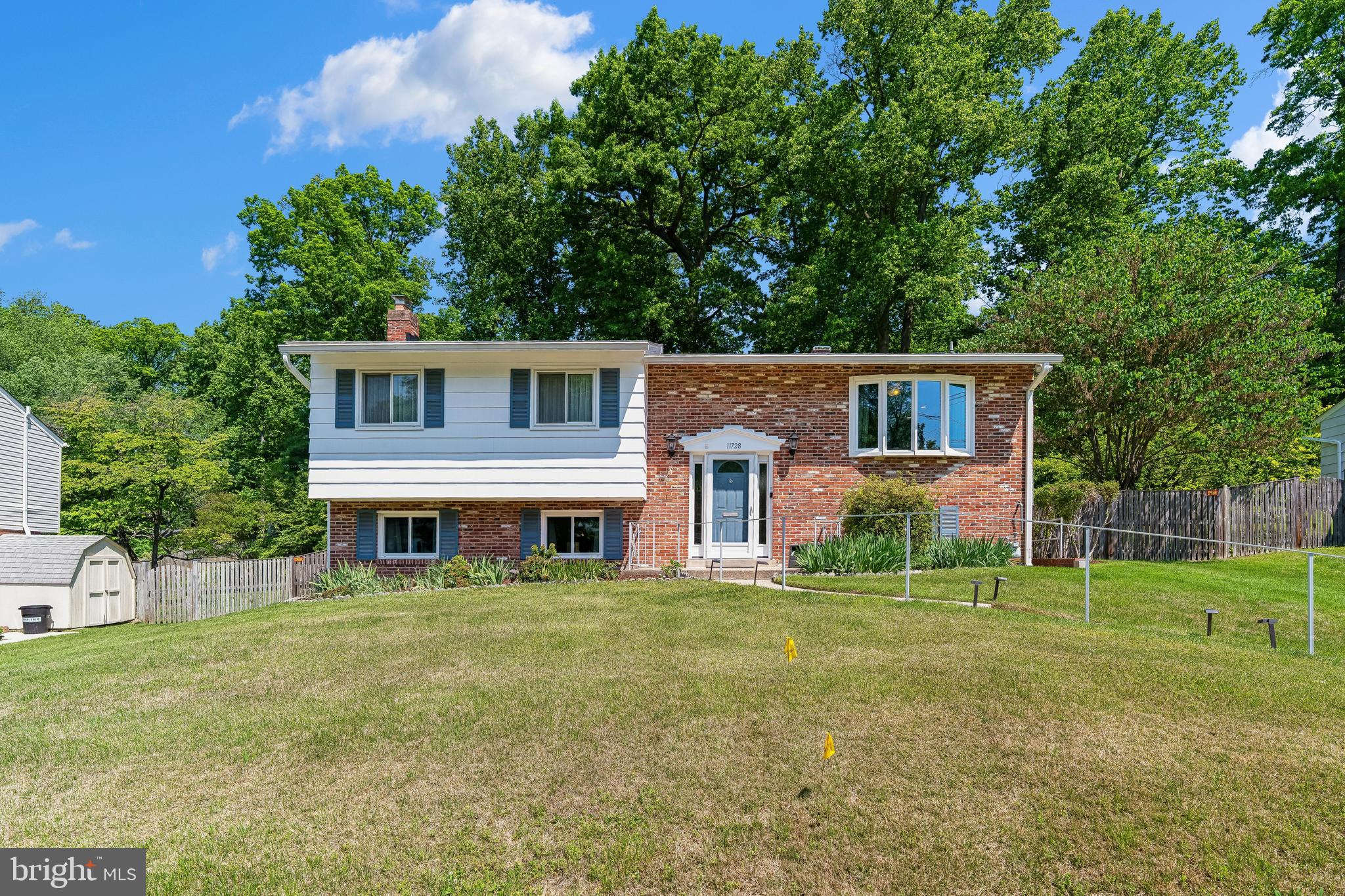 Beautifully updated, and meticulously maintained, this move-in ready home combines modern updates, comfortable living, and timeless charm in the heart of the highly sought-after Kemp Mill community. Known for its strong neighborhood spirit, tree-lined streets, parks, and convenient commuter access, Kemp Mill offers a rare blend of suburban tranquility and close-in convenience.

The thoughtfully renovated kitchen features rich cherry wood cabinetry, stunning quartz countertops, stainless steel appliances, luxury vinyl tile flooring, and a cleverly designed pop-up electrical outlet for added convenience. The sun-filled breakfast area, highlighted by an updated bay window, creates the perfect setting for morning coffee, casual dining, or enjoying your favorite indoor plants.

The main level offers an inviting flow ideal for both everyday living and entertaining. The entry, living room, and dining room are enhanced by updated lighting, elegant Norman SmartDrapes, an upgraded sliding glass patio door, and beautifully maintained hardwood floors throughout.

Both the hall bath and the spacious primary en-suite bath have been tastefully renovated with stylish vanities, updated tile flooring, mirrored medicine cabinets, and beautifully tiled shower and tub surrounds, creating relaxing spa-like retreats.

The finished daylight walkout lower level adds exceptional versatility, featuring a comfortable family room with built-in bookcases, a lower-level bedroom that also functions well as a home office, and a newly added full bath conveniently situated in the hallway adjacent to the bedroom. A separate laundry room with an LG front-loading washer and dryer adds both convenience and functionality.

Additional improvements include energy-efficient replacement windows and doors, along with an updated Lennox HVAC system paired with a Nest programmable thermostat for year-round comfort.

The home also offers exceptional storage solutions, including durable vinyl flooring, built-in cabinetry, and three large metal storage units to help keep everything organized.

Outdoor living is equally impressive. The beautifully updated patio features widened slate steps, pavers, and a retaining wall, creating an ideal setting for relaxing or entertaining guests. The fenced backyard is lovingly landscaped with mature plantings, seasonal flowers, and vibrant foliage throughout the year. A standalone storage shed, complete with gardening tools, adds even more appeal for outdoor enthusiasts.

Ideally located within the Kemp Mill neighborhood, the home is just moments from the Kemp Mill Swim Club, Northwest Branch Trail, Kemp Mill Urban Park, and Kemp Mill Estates Local Park. Residents also enjoy the convenience of the nearby Kemp Mill Shopping Center, featuring a grocery store, restaurants, shops, and everyday essentials. The neighborhood is also known for its active community atmosphere, nearby recreational amenities, and easy access to both nature trails and neighborhood gathering spaces.

Commuters will appreciate the home’s outstanding location with convenient access to bus lines, the Red Line Metro, I-495, Route 29, and the ICC/Route 200, providing easy connectivity throughout the Washington metropolitan area.

With its extensive updates, flexible living spaces, beautiful outdoor setting, and prime location in one of Silver Spring’s most established and welcoming communities, this home offers an exceptional opportunity to enjoy the very best of Kemp Mill living.