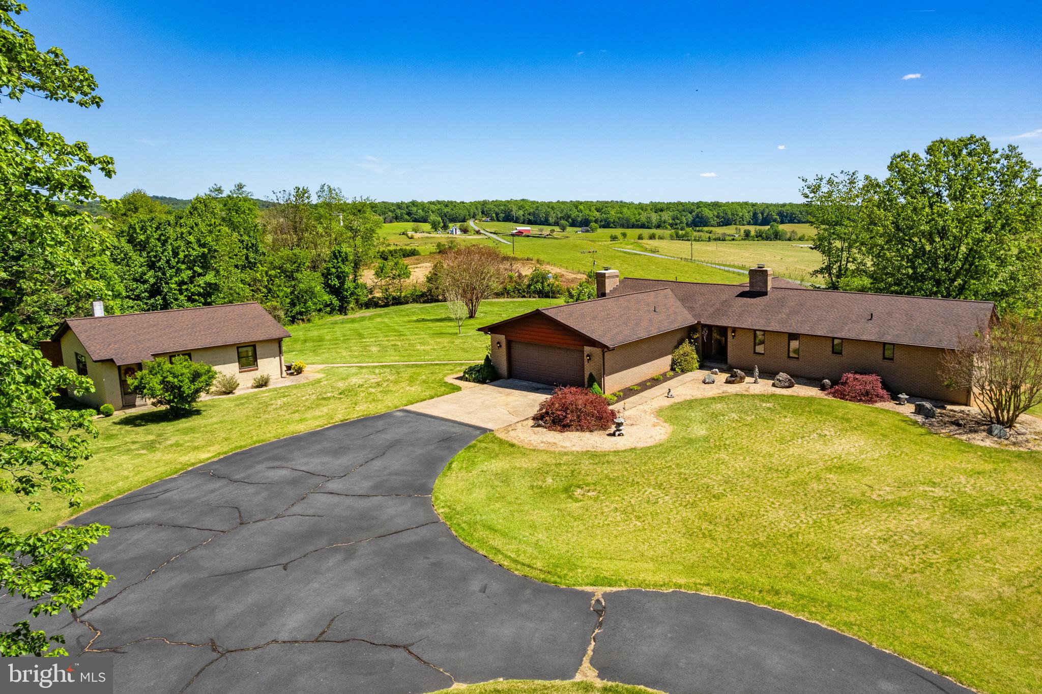 Rare Opportunity! First Time on the Market! 🌟

Imagine owning 12.45 acres with  farm views that are permanently protected in conservation—meaning your view will never change! This custom-built, one-owner brick rambler offers over 2,500 sq. ft. of pristine, one-level living.

Why you'll love it:

Sun-Drenched & Open: Rare for 1981, this bright, open floor plan features massive Pella windows to take in the views.

Impeccable Vintage Charm: Pristine hardwood floors, retro fixtures, and built-ins give it a cool 80s vibe—move right in or update to your personal taste!

Big Ticket Updates Done: Roof is  5 years old; newer oil furnace and central AC installed in 2020.

Bonus Space: A full basement with a bathroom rough-in, workshop space and a dedicated wine/canning cellar.

The Studio/Second House: Complete with water, electric, and a wood stove. Ideal for an Airbnb, home business, workshop, or guest cottage! Ready for your vision!

The Grounds: Decades of lovingly curated, established landscaping surround the home. Shed to store all the gardening items.

Don't miss the chance to own a custom piece of paradise with views that last a lifetime!