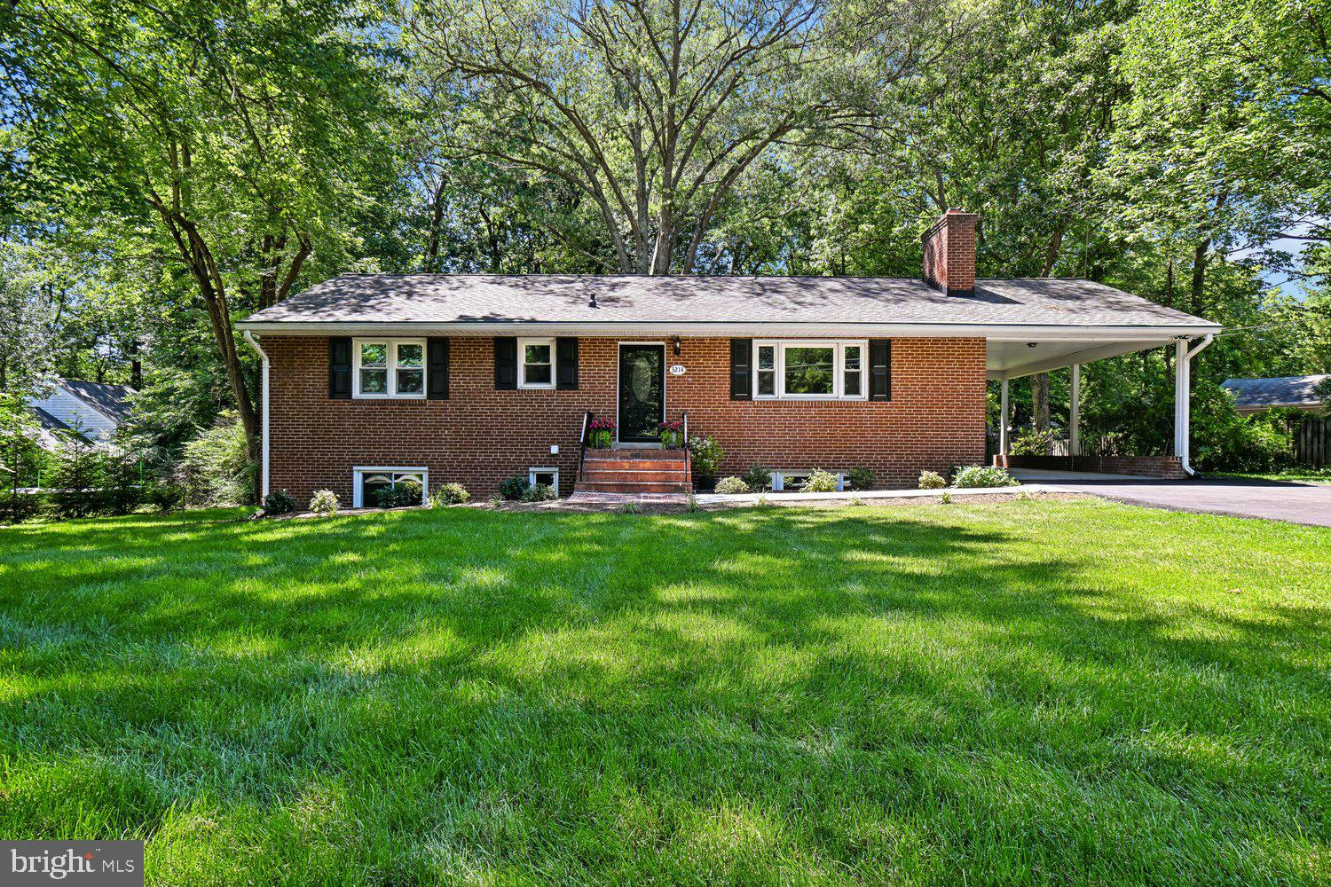 A beautifully re-imagined 1960 brick rambler in sought-after Mantua, this 5-bedroom, 3-bath home offers the rare combination of classic neighborhood character, substantial modern renovation, and an exceptional level lot of more than one-half acre.  With approximately 2,600 finished square feet and major 2026 improvements throughout, the home has been thoughtfully renewed for today’s living while preserving the quiet, established appeal that makes Mantua one of Fairfax’s most respected communities.

Inside, the renovation is comprehensive and practical.  The home features three completely new full baths with new plumbing, a redesigned kitchen with new cabinetry, quartz counters, new flooring, updated electrical, and new GE appliances including range, microwave, refrigerator, freezer, disposal, and dishwasher.  Refinished oak hardwood floors add warmth to the main level, while new lower-level LVP flooring provides durability and function.  New recessed lighting and updated fixtures create a clean, finished feel, and the two fireplaces have been refreshed with handsome new stone facing.

Major system and infrastructure updates provide important buyer confidence, including new electrical wiring throughout, new electric service, new duct work, a new forced-air HVAC system with air conditioning and electric furnace, new gas water heater, new water supply plumbing, new doors throughout, new washer and dryer, new utility sink,  new concrete walk from driveway to front steps, a new asphalt driveway, and a new concrete carport floor.  The exterior has also been enhanced with new landscaping and sod in the front and side yards, along with a refurbished large rear deck overlooking the expansive, level rear yard.

Set on more than 22,550 square feet of landscaped land, the property offers space for outdoor entertaining, play, gardening, recreation, and future flexibility.  Mantua is prized for its mature trees, quiet streets, generous lots, neighborhood identity, nearby parks, trails, and green spaces.  The location also offers convenient access to Fairfax, Mosaic District, Tysons, Arlington, Washington, D.C., Route 50, I-495, I-66, nearby Metro stations, Reagan National Airport, and Dulles International Airport.  A move-in ready Mantua home with the major renovation already completed, this property delivers a rare blend of renovation, setting, location, land, and long-term value.