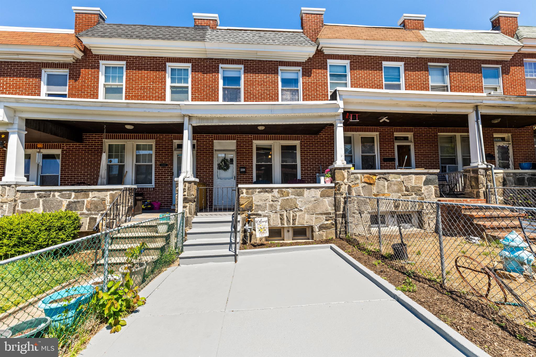Welcome to 1238 W. 37th Street, a charming three-bedroom, one-and-a-half-bath home ideally located in the heart of Hampden. A welcoming covered front porch sets the tone as you step inside to a spacious living room featuring hardwood floors and soaring ceilings. The adjoining dining room offers plenty of space for gatherings and entertaining, while the well-appointed kitchen provides access to the rear deck, creating a seamless indoor-outdoor lifestyle.
Upstairs, you'll find three generously sized bedrooms with ample closet space and a beautifully updated full bath with stylish tile finishes. The finished lower level adds valuable living space, perfect for a family room, home office, workout area, or playroom. A convenient half bath, laundry area, and additional storage complete the lower level.
Enjoy multiple outdoor spaces, including the inviting front porch, rear deck, and fenced yard—ideal for relaxing, gardening, or entertaining friends and family. Located just three blocks from Hampden's vibrant "Avenue," you'll have easy access to neighborhood favorites, local shops, restaurants, and all that makes this community one of Baltimore's most beloved destinations. An unbeatable combination of charm, space, and location!