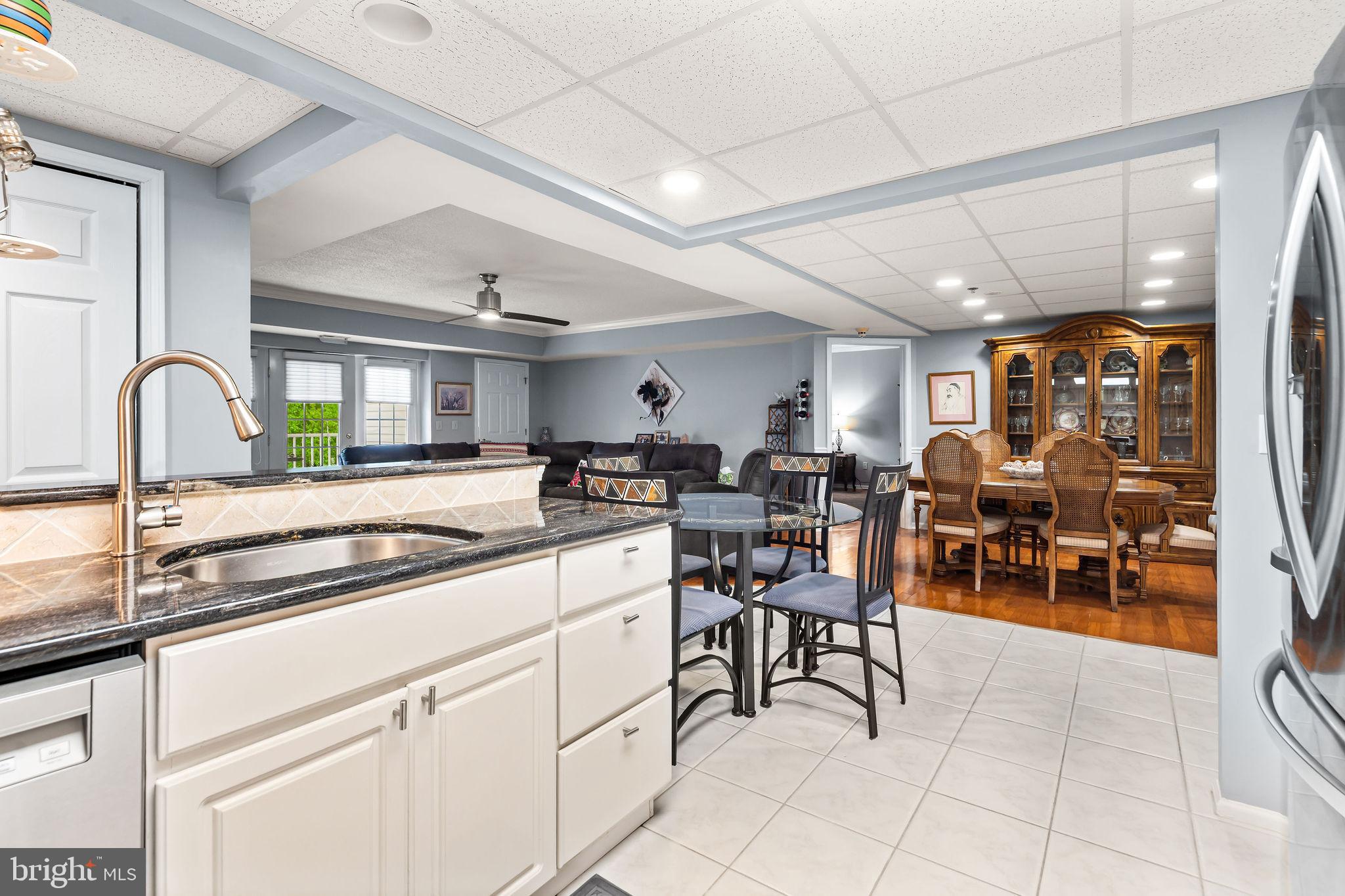 2 for 1 Open House at Building 8 on Sunday June 7 from 11am-1pm!   Looking for it all? Your search is over! You will not be disappointed by this stunning Custom Condo nestled in  the desirable and established 55+ development of Centennial Station in Bucks County. This open concept 2 bedroom 2 bath home is immaculately clean and truly shows like a Sample. Professionally designed to take maximum advantage of every square foot, this property is truly stunning. Upgrades include but are not limited to: Gorgeous Ceramic Tile in the Foyer & Kitchen; Custom Paint; Ceiling Fans in Living Room and both Bedrooms; Real Hardwood in the Living Room, Dining Room, and Both Bedrooms; California Closet in  Main Bedroom Walk-In; Replacement Windows;  Both Bathrooms Beautifully Updated with Marble Vanities and Modern Showers; Enlarged 2nd Bedroom with Handsome Full-Wall Built-In Bookcase; Built-In Desk in the Office; Huge Open Kitchen with Upgraded Cabinets, Granite Counters, Stainless Appliances, and Ceramic Backsplash; Extensive Crown Moulding.  At almost 1,600 square feet, this 2nd floor Sandpiper Model is in Pristine Condition, boasts designer finishes and custom Built-In Furniture.  Don't worry about downsizing from your single home.  This spacious condo feels more like a 2 Bedroom Rancher than a Condo and has all the room you're likely to need and storage galore including several Common Area Storage Closets.  Located in a Dramatic Sky-Lit Atrium Style building not found in any of the other local active adult communities.  You'll get the convenience and low maintenance advantages of a condominium blended with Single Home Features and Room Sizes.  Building 8 is one of our smallest buildings but sits on a full size parking lot so it offers a Superior parking situation.  Building 8 is also Very Proximate to the Main Entrance of our Extensive Activity Center.  Like all our Buildings, Building 8 features Concrete/Cinderblock Construction, a Large Otis Elevator and Sprinklers Throughout Units And Common Areas. Condo Fee Includes Trash, Snow, Water, Sewer, Cable T.V. Security System Monitoring, Master Policy Insurance Plus Activity Center W/Indoor Year-Round Heated 25M Pool, Exercise Room, Card Room, Billiard Room, Coffee Bar, And Grand Meeting/Banquet Room. Commercial Wing Has convenient Real Estate Office offering free Notary, Faxing, and Copying for residents, Restaurant, Hair Salon, and Dentist. No dogs except service/support animals. Only one resident has to be 55 yrs old provided all other full time residents are over the age of 18.