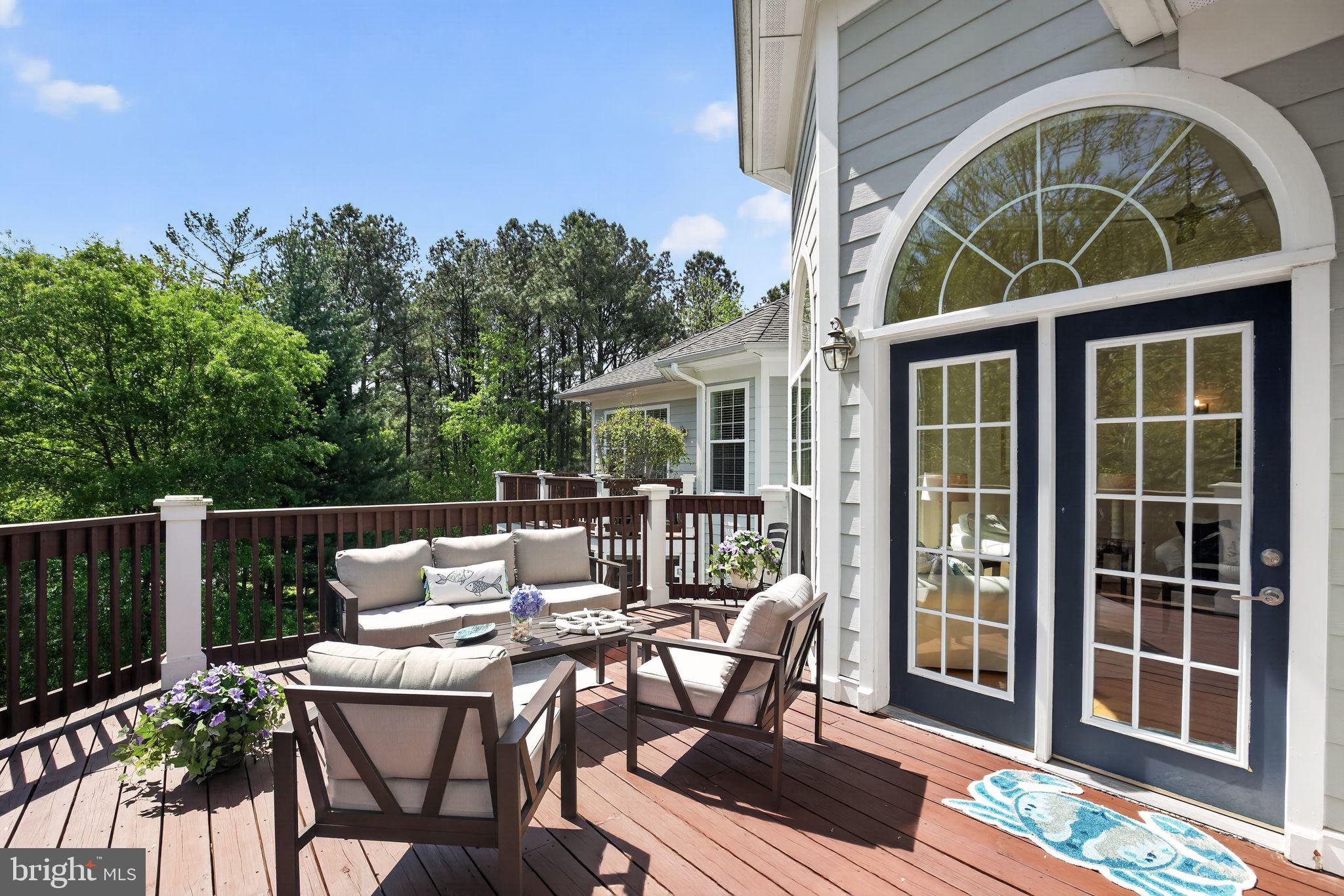 The open design of the Tred Avon floor plan of this top floor end unit  is a stunning Solomons Landing offering creating a waterfront lifestyle facing the Back Creek shoreline that can be enjoyed at your doorstep. A waterside trail surrounds the community where there are piers and kayak racks, as well as a community marina that offers a variety of slip possibilities, providing numerous opportunities to enjoy the water. The living room features Palladian windows with views to the water, beautiful maple flooring, and dramatic ceilings.  Enjoy a fabulous kitchen with extensive cabinetry, expansive granite food prep surfaces, gas cooking, recently replaced stainless appliances, a large pantry, and a breakfast nook - it will be loved by those who appreciate  the culinary experience, the kitchen opening to a large dining area that is a perfect entertainment space.  Relax in the spacious primary suite featuring transom windows creating architectural interest and a bright and welcoming area, with an ensuite bath featuring separate vanities, walk-in shower and soak tub,  The large corner deck can be accessed from the main living area as well as the primary bedroom, providing extended outdoor living. A number of attractive appointments have been added by the sellers making this unit a very special option for full time or second home living.  Waterfront living and resort style amenities await - and yes, there is pickleball, with newly refurbished courts - convenient to charming Solomons where the Chesapeake Bay lifestyle is incomparable.