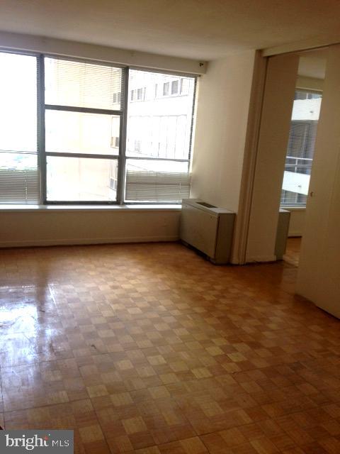 Spacious one bedroom showcasing partial views of Rittenhouse Square at The Dorchester! Enter through a foyer with large coat closet into the combined living and dining room boasting large windows, plenty of natural light, and views of The Square. Adjacent is a renovated kitchen with wood shaker cabinetry, quartz countertops, stainless steel appliances, and tile flooring. There is a large bedroom with excellent closet space that enjoys use of an ensuite bathroom with tub shower, white tilework throughout, and tile flooring. Highlights include parquet wood floors and excellent closet space throughout. Residents of The Dorchester enjoy a twenty-four hour doorman and all utilities are included in the condo fee except basic cable/internet. Use of the building’s state-of-the-art fitness center, seasonal rooftop pool club, and valet parking in the building’s underground garage are available for an additional fee (subject to availability). No pets permitted. Location is everything...Rittenhouse Square was ranked the 6th best neighborhood in North America with 175 restaurants and 199 retailers within a three block radius. Be within close walking distance to the Market Street office corridor, The Avenue of the Arts and University City. 30th Street Station and Philadelphia International Airport are only minutes away.
