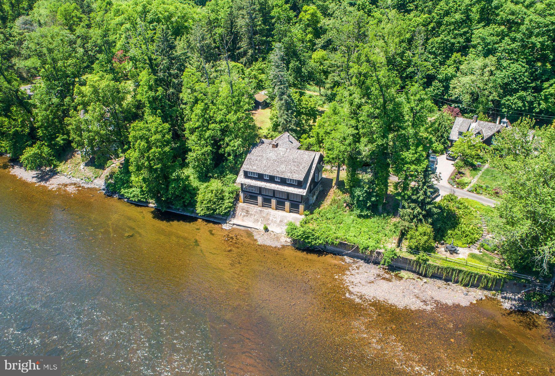 "Edgewater Manor" brings the style of an Adirondack cottage on the banks of the Delaware River.  The property boasts some of the very best unobstructed river views in Bucks County.  The property awaits it's renovation, reinvention and restoration.  Located 70 minutes to NYC, 70 minutes to Philadelphia and 15 minutes to the charming river villages of Frenchtown, Stockton, Lambertville and New Hope.