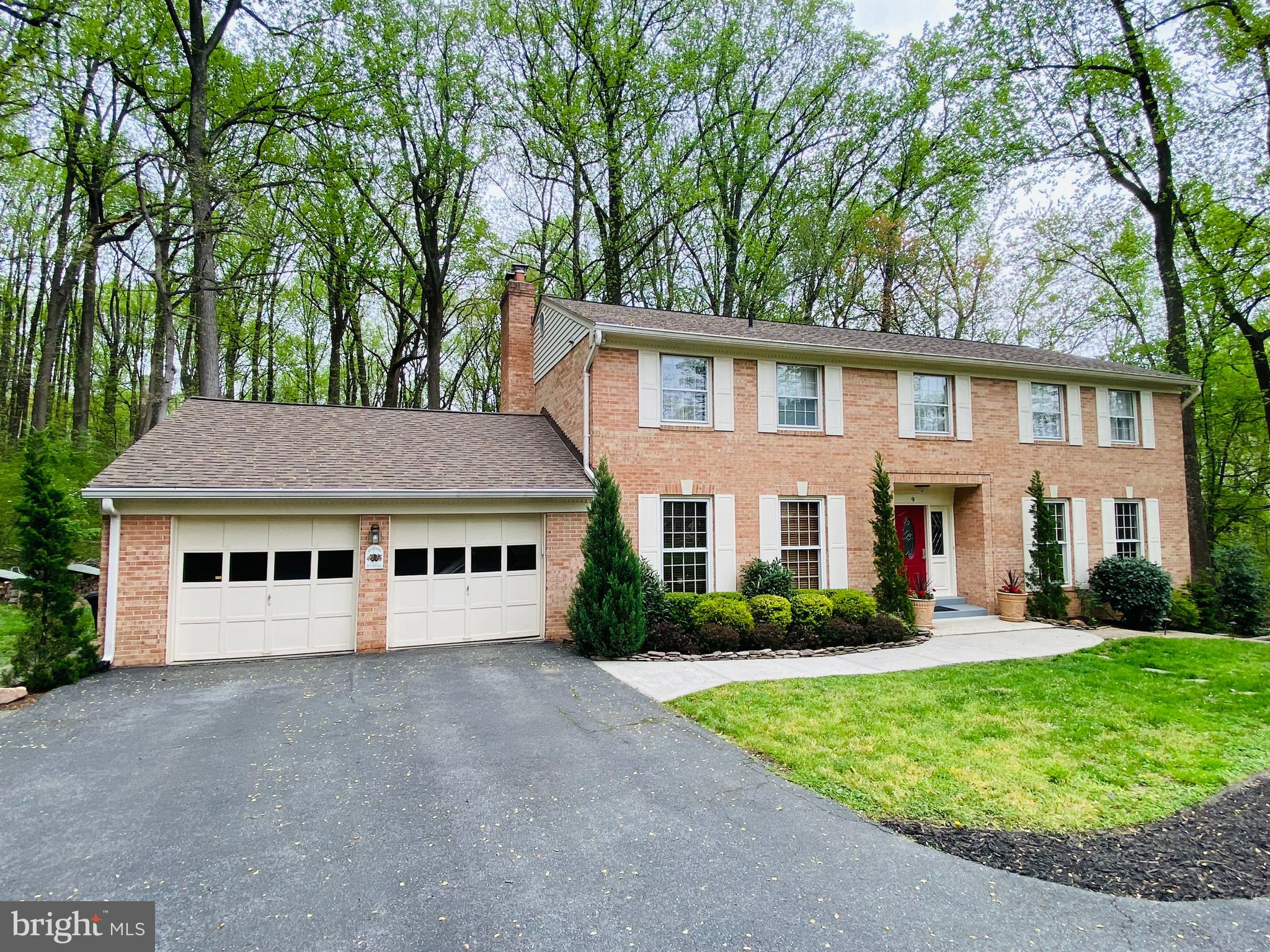 Stately 4-sided brick Colonial with a FULLY LICENSED LOWER LEVEL ACCESSORY APARTMENT, offering over 4,000 square feet of versatile living space, including 5 bedrooms, 3 1/2 baths, a main level study, and a second-floor bonus room—formerly a sitting room off the primary suite. The open floor plan features a family room bump-out with a wall of windows that fills the space with natural light and opens to a large deck, ideal for entertaining. A beautiful screened-in porch provides the perfect place to relax and take in the serene views of the private backyard. Sited on a nearly 3/4-acre lot backing to protected parkland, the property offers a peaceful natural setting with extensive landscaping, a greenhouse, and abundant wildlife. The apartment includes a private entrance, full kitchen, living room, large bedroom, full bath, stackable washer/dryer, and two ductless mini-split heat pump systems—allowing the tenant to control their own heating and cooling independently. It’s ideal for rental income, guests, or extended family.   Roof replaced in 2020; HVAC replaced in 2016.