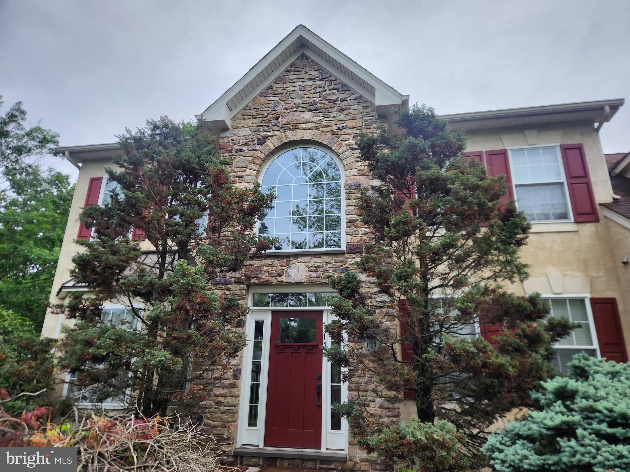 Discover the hidden charm of Cedar Crest Farms, a tucked-away community bordering preserved land and adjacent to a local park with scenic walking paths—yet conveniently located near major commuter routes in desirable Doylestown Township. From the second-floor Trex deck, enjoy picturesque views through the trees overlooking the Little Neshaminy Creek, offering a peaceful, nature-filled backdrop.

This impressive partial stone-front Colonial is set on a quiet, charming street and offers over 3,400 square feet of thoughtfully designed living space. The first floor showcases refined architectural details, including custom wood moldings, volume ceilings, and sun-filled Palladian windows adorned with plantation shutters. The gourmet kitchen is tastefully appointed with Wolf appliances, hardwood flooring, recessed and copper pendant lighting, and flows seamlessly into the bright breakfast room featuring a peninsula bar cabinet.

The open-concept layout continues into the inviting family room, highlighted by a wall of windows and a marble-surround gas fireplace—perfect for both everyday living and entertaining. A first-floor study provides an ideal work-from-home space, while the mudroom includes a built-in storage bench for added convenience when entering from the side-entry garage.

Upstairs, the expansive primary suite offers a private retreat, complete with a sitting area and charming dormer windows that create a serene atmosphere. Three additional generously sized bedrooms complete the second floor. Both the primary and hall bathrooms have been tastefully renovated with tile and granite finishes in today’s preferred style.

The unfinished daylight, walk-out basement—with roughed-in plumbing for a future bath—offers endless potential for customization.

This beautiful home presents a rare opportunity to enjoy space, comfort, and privacy in a highly sought-after Doylestown Township location. With its tranquil setting and close proximity to everything the Doylestown community has to offer, this property represents exceptional value.

Schedule your private showing today and envision the lifestyle that awaits. Seller is a PA. Licensed Realtor