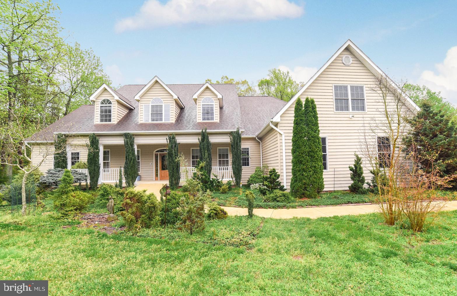 NEED SPACE FOR BIG FAMILY/IN-LAWS/EXTENDED FAMILY/BOUNCE-BACK KIDS?? This is your exceptionally well-built and meticulously maintained custom home (over 6000 sq ft)! Spacious open family rm/kitchen; living rm/office & dining room, both with French doors; sunroom with skylights & huge windows to bring the outside in. Main level boasts two master suites; second one w/living area would be perfect in-law space. Kitchen has granite countertops, luxury plank vinyl floor, custom cabinet details, stainless appl's, walk-in pantry, prep sink, big eating area. Four more BRs upstairs, each with walk-in closet and full bath! Gigantic walkout basement already has 1/2 bath and finished storage closet, plus lots of space for future plans. Upgrades include handicap-accessible features, rounded wall corners, recessed lights, extra insulation, water softener, whole-house Generac 22 KW generator, two on-demand Rennai HW heaters w/circulating hot water pump, 4-zone HVAC system w/propane backup on the main level. 3-car side-load garage w/storage closet, all on a lovely 2-acre lot with no HOA restrictions! Truly a unique home--make it yours!