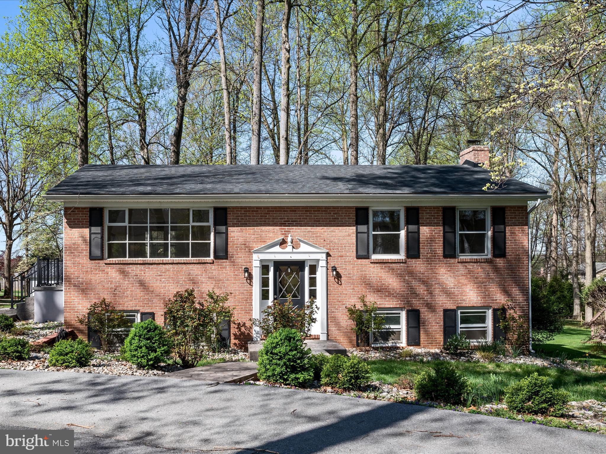 Stately home in the established Tuscawilla Hills community - close to golfing, playgrounds, and more! Nestled on a half-acre corner cul-de-sac lot, this home welcomes you with a circular drive, stamped concrete walkways, and mature landscaping that enhances its curb appeal. This 2-level residence features a primary suite with large walk-in closet and ensuite bath on the same floor as the kitchen, dining, and living room spaces - all featuring newer LVP flooring. The updated kitchen has charming accents, newer appliances, and a built-in pantry. Another full bath on this floor adds convenience and comfort for guests. There's more to appreciate on the lower level, which features a large rec room with wood stove and built-in bar area that opens to the back patio, plus 2 more bedrooms, another full bath, and laundry facilities. All of the carpeting was just replaced as well. In the backyard, there's a large shed and an ideal place to erect an above ground pool to enjoy the upcoming summer months. With easy access to Rt. 51, downtown Charles Town, commuter routes, and other local amenities, this versatile home affords the proximity and features you'll love. Make this move-in ready space your own!
