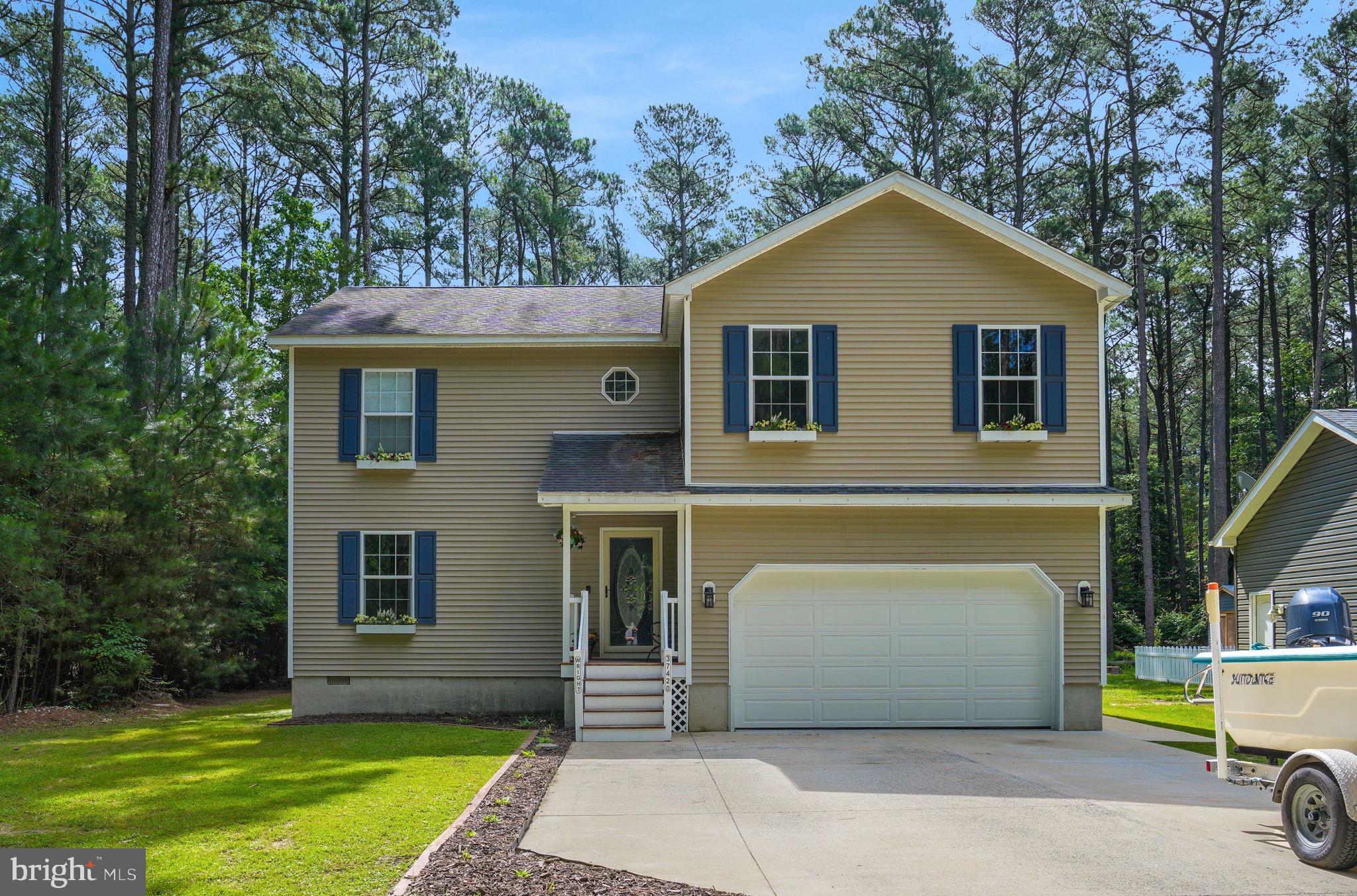 Beautiful contemporary home in the sought-after Captain’s Cove community offering 3 bedrooms plus a private office and a versatile bonus room, ideal for remote work, guests, or recreation. This well-designed home features an open-concept main level with a spacious living room, soaring cathedral ceilings, LVP flooring, and a cozy wood-burning fireplace. The modern kitchen is perfect for entertaining with granite countertops, stainless steel appliances, oak cabinetry, and a center island. A dedicated office, separate laundry room, and convenient half bath complete the main level. Upstairs, the primary suite includes a private ensuite bath, while two additional bedrooms share a full bath and easy access to the bonus room—perfect as a playroom, gym, or media space. Outdoor living shines with a screened-in porch and two-tiered deck overlooking a large cleared lot with peaceful wooded views. Additional highlights include a two-car attached garage and storage shed. Located in Captain’s Cove Golf & Yacht Club, residents enjoy access to golf, marina, pools, fitness center, tennis courts, dining, and year-round amenities.