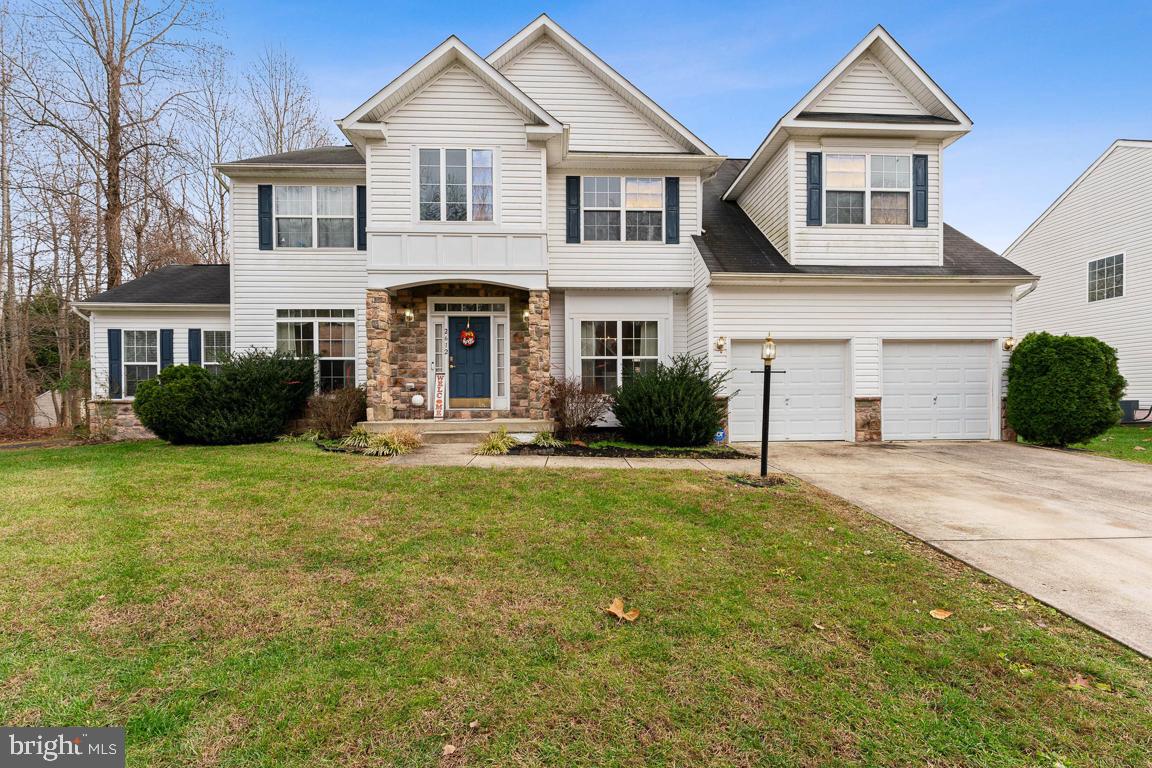 Location, location, location! This beautiful 13,332 square feet on 0.3060 acres Colonial on 3 levels two car front garage that has a grand foyer with gleaming hardwood floors.  This home features a sunny attractive Conservatory and a formal living room, dining room and a family room with cathedral ceilings with a cozy fireplace and home office to allow a comfortable workplace.  The spacious eat- in kitchen has an island with a breakfast area. The upper level has 4 bedrooms with an expansive main bedroom suite with  a Jacuzzi bath.  This home is Waiting for You! The location is a short drive to the Nation's Capital and a short commute to the State Capitol in Annapolis and within 3 miles to the Beltway for easy access to shopping malls.
