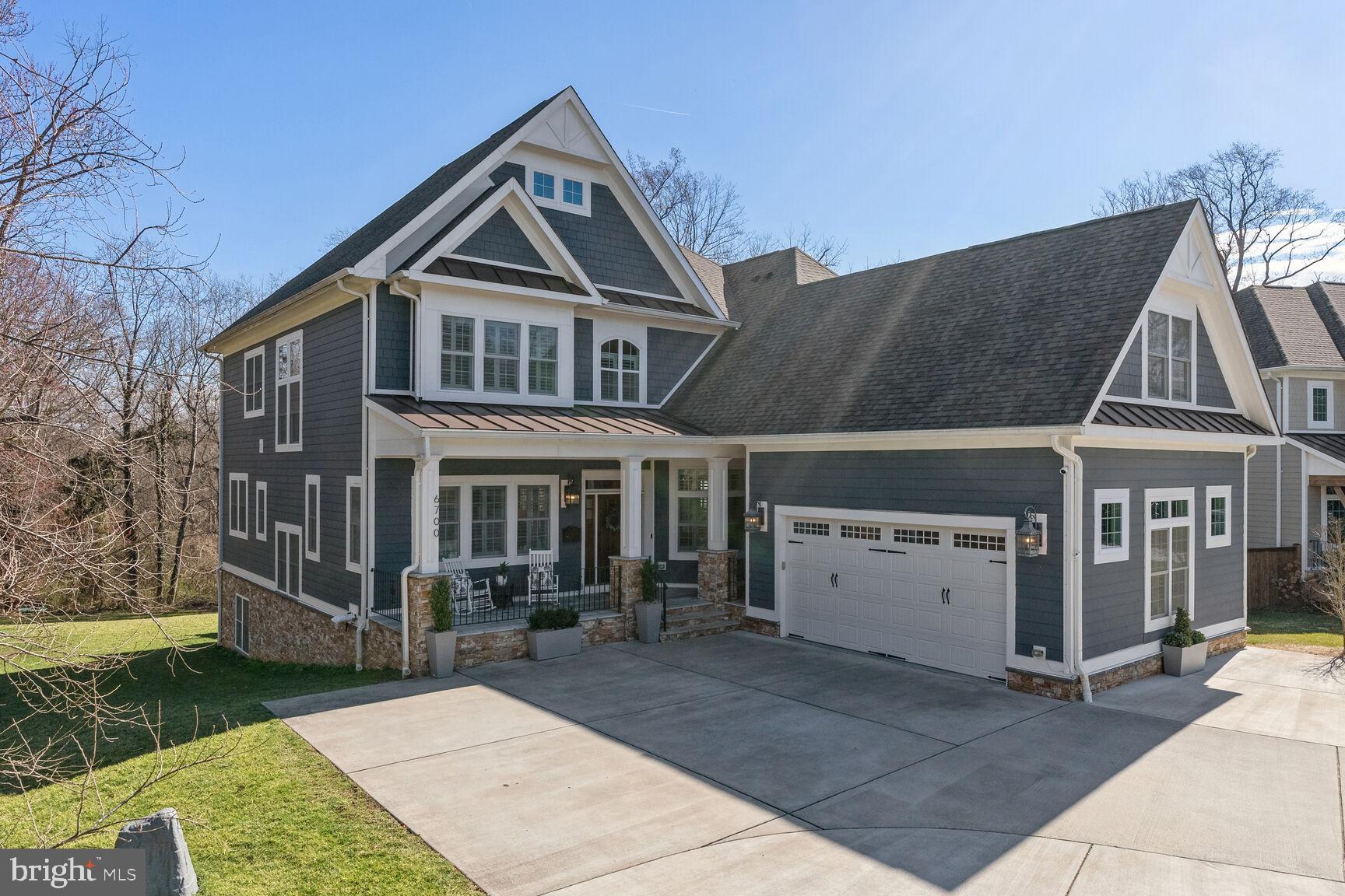 ***OFFER DEADLINE MONDAY 2/27 NOON***This impressive home offers details expected by buyers looking at “new builds” while also providing a generous*** HALF ACRE LOT  on a  cul de sac that BACKS TO PARKLAND***.  A winning combination rarely available. The understated front footprint belies the grandeur of this 6400+SF home that boasts 6 bedrooms and 6.5 baths with 2 ideal in-law/au pair suite options. Step inside and you will see the gorgeous walnut wood floors,  10' ceilings and generous open floor plan.  Impressive craftsmanship throughout the house begins in the formal living and dining rooms off the entrance foyer. Step through to the great room with its floor-to-ceiling stacked stone fireplace.  The stunning gourmet kitchen features THERMADOR appliances, a large island with quartz countertops and a separate butler's pantry.  Enjoy breakfast at the built-in banquet or, weather-permitting, on the screen porch or the deck, with views of the beautiful tree-lined parkland at the rear of the property. At the front of the house you will find a thoughtfully designed, separately accessed mudroom with generous built-ins and a staircase to one of ***two potential in law/au pair suites/office spaces***. This suite provides a feel of separation from the rest of the home in its own private upper living area. A main level library with built-ins has terrific views over the yard. The incredible lower level was COMPLETELY RENOVATED IN 2021 by the current owners.  An impressively designed entertaining area with a gorgeous kitchen with refrigerator and dishwasher, plus a bar area with wine fridge and ice maker make this a wonderful second entertaining space.  Also on this daylight lower level, is a bright guest suite with large windows and one of two exceptionally renovated bathrooms on this level  - with premium fixtures, steam shower and tile. There is a top quality workout room, second bathroom and a beautiful laundry room to complete this remarkable garden level. Walk out to the back yard and stroll along the paths or explore the Pimmit Run at Kent Gardens park. The builder was thinking ahead as the patio has been roughed in for an outdoor kitchen and the side yard has utilities roughed in for an extra garage or potential living space.  Both the back and side yards could easily accommodate a pool and leave plenty of green space. The spacious primary suite on the upper level overlooks the tree lined vista and is complete with a gas fireplace, sitting area and separate walk-in closets. The luxury primary bath has heated floors and an architectural stand alone tub.  This level has three other generous bedrooms, each with an en suite (two share a jack and jill bath), plus a second laundry room.  The garage has tons of storage and a charger for an EV vehicle. *** Kent Gardens, Longfellow, McLean school pyramid.***  Easy access to  West Falls Church and McLean Metrorail stations,  Tyson, Capitol Beltway and DC.
