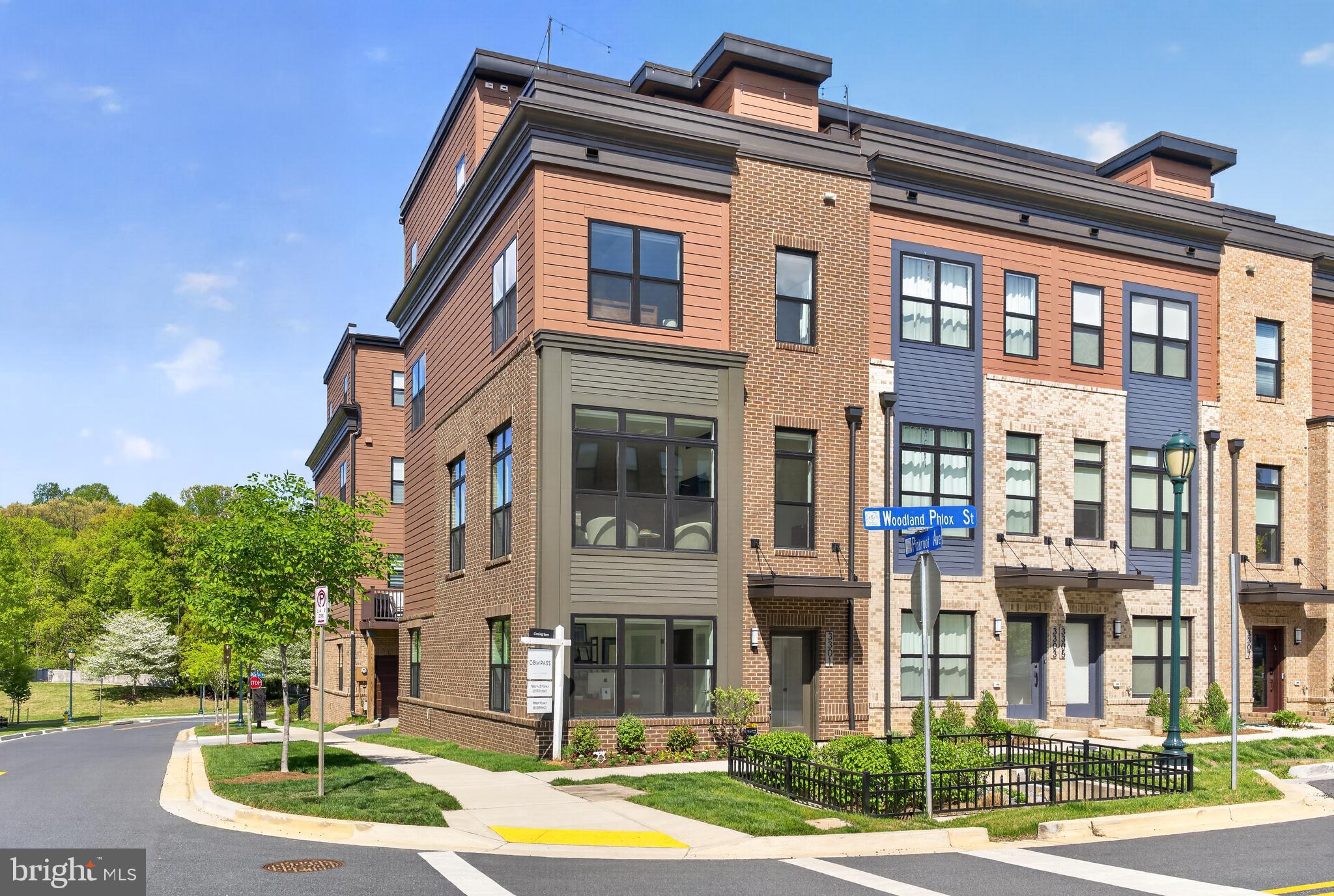 Stunning and immaculate 4-bedroom, 5-bath nearly-new EYA corner townhouse with a private elevator servicing all four levels, ideally located in the highly sought-after Tower Oaks community. With over $251,000 in premium upgrades and designer enhancements, this sun-filled residence offers refined style, modern comfort, and exceptional functionality throughout.

The entry level offers a versatile bedroom, private home office, or fitness space with an adjacent powder room and direct access to the spacious two-car garage—perfect for today’s flexible lifestyle.
The main level impresses with soaring 9.5-foot ceilings and a show-stopping gourmet chef’s kitchen appointed with top-tier cabinetry and appliances, including a paneled Bosch refrigerator, a top of the line Wolf multi-use double oven, Bosch dishwasher, and Thermador cooktop. Quartz countertops, an expansive waterfall island with abundant storage, upgraded tile backsplash, under-cabinet lighting, water filtration system, and designer pendant lighting complete this exceptional space. A spacious pantry, dedicated bar area, and seamless access to the private deck make entertaining effortless. The sunlit living room features a gas fireplace, while a stylish powder room completes the level.

The third level offers a luxurious primary suite with a bump-out extension, two walk-in closets, and a spa-inspired en-suite bath with dual vanities and a walk-in shower. A generously sized second bedroom—large enough for a queen bed—includes its own en-suite bath and walk-in closet. A conveniently located laundry room with full-size Electrolux washer and dryer adds everyday ease.

The top level is designed for elevated living and entertaining, offering an additional 4th bedroom with a full en-suite bath, a spacious media room with an electric fireplace, and access to a private rooftop terrace through double sliding doors with private treetop views. Ample storage is found throughout the home.

Additional highlights include luxury vinyl plank flooring, solid oak hardwood stairs, a modern steel rail system, recessed LED lighting, and smart home window treatments. Major systems include a two-zoned HVAC and water heater (2023), offering peace of mind. All three upper-level bedrooms are equipped with Hunter Douglas smart blackout shades (2023). The oversized two-car garage provides additional storage.

Residents enjoy access to exceptional amenities at The CORE, including a state-of-the-art fitness center, yoga studio, café and lounge, club rooms, outdoor pool, fire pits, grills, tot lot, green spaces, sports courts, pickleball courts, and an on-site property manager—all for a low monthly HOA fee of $249.

Ideally situated across from Clyde’s and just minutes to Park Potomac and Pike & Rose, this coveted EYA Bailey model offers convenient access to top-rated dining, shopping, parks, and major commuter routes including I-270, as well as nearby Twinbrook, North Bethesda, and Grosvenor Metro stations—delivering luxury living with unmatched convenience. A rare opportunity to own one of EYA’s nearly-new elevator townhouses. Truly a must see!