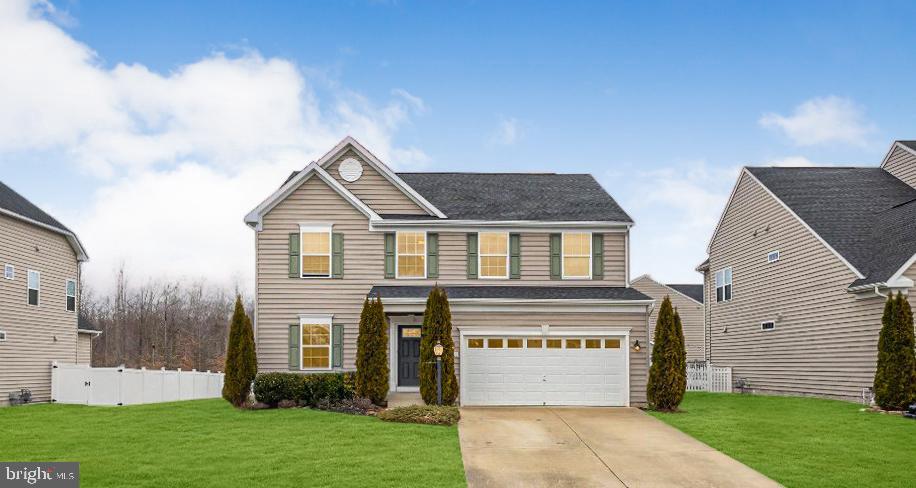 This three-level sprawling colonial offers nearly 5000 sq/ft in a sought-after community. The main level includes a gourmet kitchen with stainless steel appliances, granite countertops, double ovens, an oversized island, and plenty of cabinet storage. Adjacent to the kitchen is a spacious family room with a gas fireplace. The upper level features an extensive primary suite with walk-in closets and an en-suite bathroom that includes a soaking tub, separate shower, and dual vanities. There are also three additional bedrooms, two full bathrooms, a flex area, and a laundry room on this level. The finished lower level includes a large open area, a full bathroom, and a walk-up exit to the backyard. The fully fenced backyard allows space for outdoor use. Additional features include a whole-home generator,a built-in water filtration system, a lawn sprinkler system, and a 2-car garage. This home is located close to schools, shopping, dining, and major commuter routes.