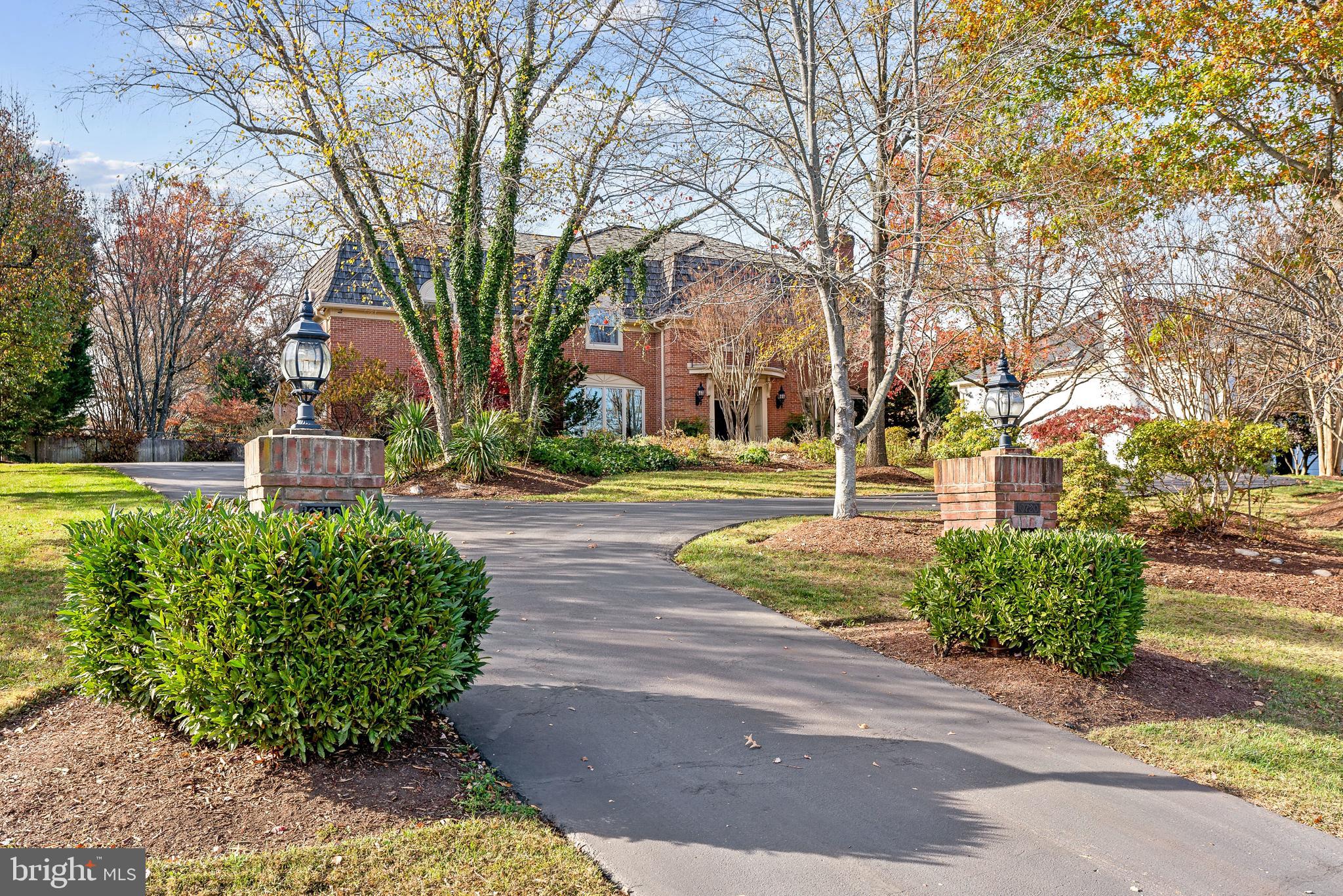Perfectly sited on a premium lot in the heart of Potomac, this elegant 7,100-square-foot custom home offers a beautiful backdrop for modern living and entertaining on any scale.  Enhanced with 4 wood-burning fireplaces, arched accents, beamed ceilings and exposed brick, the home is warm and inviting.  The floor plan features an expansive living room open to the dining room, a powder room, and a main-level home office with built-ins.  Designed to maximize the natural light, Anthony Wilder renovated and adjoined the kitchen to the family room, adding walls of floor-to-ceiling windows that create a stunning indoor/outdoor connection.  The kitchen is appointed with an island and also includes a delightful breakfast area tucked into an alcove of windows.  The private backyard is fully fenced, professionally landscaped and complete with a tiered brick garden wall and stairs that lead to a heated pool and spa.  A main-level full bath with access to the backyard provides the perfect accessory for summer swimming and outdoor gatherings.

Ascend the stairs to 5 upper level bedrooms and 3 full baths. The primary suite includes a fireplace, three incredible custom-designed and expansive closet systems, and a recently renovated full bath with a soaking tub, shower and a separate dressing area with a double-sink vanity and sitting space.  The spacious bedrooms include two that are connected with a Jack-and-Jill bath, and two others with access to another renovated full bath.  

Every detail was considered for entertaining at home; there’s a fully finished lower level with a billiards area, a media/recreation room with a fireplace and built-ins, and even a wine-tasting area with an accessory sink. A large bonus room, a full bath and a kitchenette with table space add additional function to a home designed for gathering with friends and family.    

Located within the renowned Winston Churchill High School cluster, 10720 Stapleford Hall Road has easy access to fine restaurants and shopping in Potomac Village, and is moments from commuting routes into the city.  Available for the first time in more than 35 years, this home offers a lovely landing for gracious living and entertaining, where all can enjoy the many wonderful amenities and the beautiful outdoor views through every season. Welcome Home!