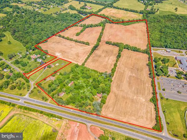 Fully Entitled 97-Acre Residential & Commercial Development Land in Fauquier County, Virginia.

White Marsh represents one of the most important development opportunities for residential and commercial growth in Bealeton, Virginia. Located in Fauquier County, Bealeton is a vibrant suburb of Washington DC that provides a unique blend of agricultural, commercial, and residential developments.  This peaceful north-central Virginia town allows easy access to Fredericksburg, Warrenton, Manassas, and Gainesville through I-66 and I-95 via Routes 29, 28, or 17, making it an ideal location for the proposed expansive community development. 

The property offered for sale consists of four (4) contiguous parcels strategically located adjacent to Liberty High School, across the street from the newly built Mintbrook Village and surrounded by nearby retail centers and residential communities.  This property received county approval in 2010 for a development known as White Marsh, with the idea of creating “an entire neighborhood with opportunities for its inhabitants to work, live, conduct business, shop and engage in recreation.”  The White Marsh vision includes “shops, restaurants, boutiques, service establishments and professional offices (to) provide a range of services and employment opportunities for residents.”  Residential planning includes a mix of 141 single family detached units (77 units age restricted), 24 single family attached units (20 units age restricted), 152 age restricted multi-family units, 130 assisted living care units and 14 live-work units.  The site plan assumes a commercial development in the front section of the property with “retail and office uses, specially planned commercial uses including a boutique hotel, a medical office center, and a Continuous Living Facility.”   The previously approved site plan is consistent with the Bealeton Service District Plan adopted on June 6, 2013. 

Bealeton enjoys tremendous growth with strong residential demand leading the way.  The popular Mintbrook residential and commercial development led by Ryan Homes and NVRetail is a significant success and includes hundreds of single family homes and townhomes, plus the three-story, 80 unit Mintbrook Senior Apartments.  While residential construction is still finishing, the Mintbrook development completely sold out quickly.  With White Marsh being directly across from Mintbrook, the next owner will capitalize on this development opportunity where there is proven consumer demand for the finished product. 

Bealeton boasts an exceptional blend of city-country balance.  Tranquil and serene, Bealeton is known for its lush landscape, and the Whitney State Forest and Brandy Station Battlefield Park do not disappoint.  Popular attractions include the bustling Messick’s Farmers’ Market and Morais Vineyards & Winery, a Portuguese-style winery with wedding venue that attracts thousands of people each year.  For high-flying fun, The Flying Circus Aerodrome & Airshow is a local favorite and brings in guests from all over Virginia.  Downtown Bealeton offers quaint antique stores and charming cafes, and nearby Old Town Warrenton provides more restaurants and boutiques for residents and visitors alike.

This is an outstanding opportunity for a developer that can take on both residential and commercial projects, or a residential builder teamed with a commercial development partner.  The land is undeveloped with a mix of open space and trees, with the exception of several structures that may be torn down during development.  The farmland is subject to an annual lease agreement and is currently held in land use, resulting in significant real estate tax savings while holding the property for development.  The property is master-planned for utilities in the Bealeton Service District Plan with public water and sewer available on the adjacent Liberty High School property.