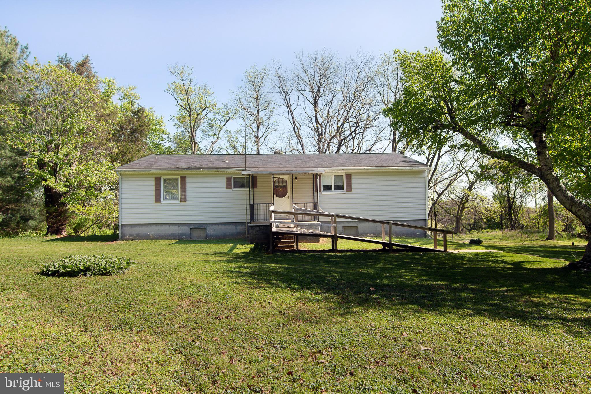 PRIDE OF OWNERSHIP.....This home is clean and ready for you.  Move in and add your personal touches.  Beautiful lot with two out buildings. Country living for all.  This home offers a very large kitchen.  The huge great room with a brick  fireplace  will be enjoyed by all.   Enjoy the beautiful hardwood floors .   The lower level offers multi rooms and awaits your imagination. The furnace was replaced at the end of 2024. Close to shopping and yet in the country.  Ramp at front door can be removed if you wish.  
Come look and buy!!!!  This is an Estate Sale and is being sold AS-IS, Buyer responsible to confirm zoning
